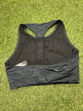 Rear view of black Everlast sports bra showing racerback design and branded elastic strap