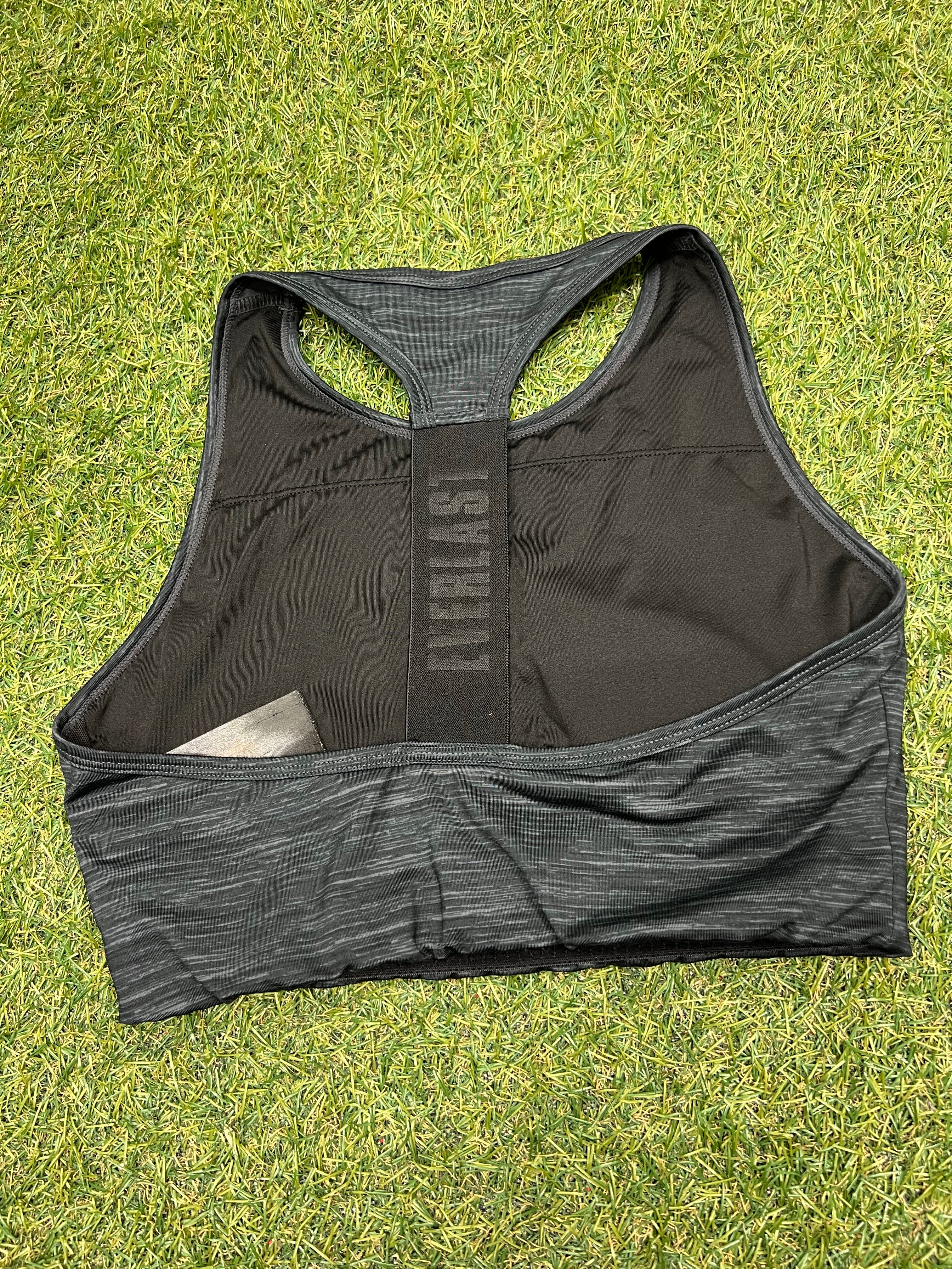 Rear view of black Everlast sports bra showing racerback design and branded elastic strap