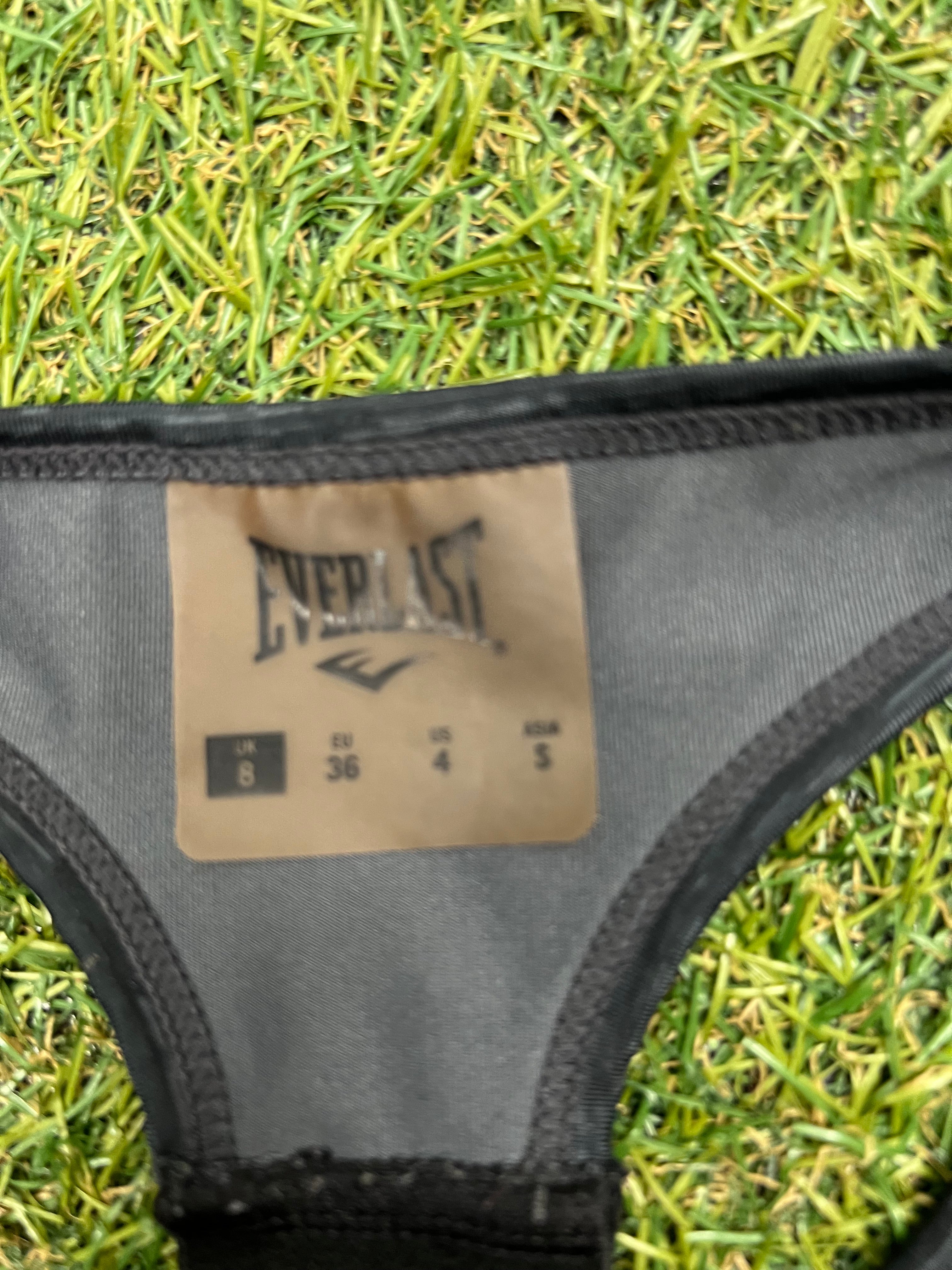 Close-up of Everlast size label inside sports bra showing UK 8, EU 36, US 4
