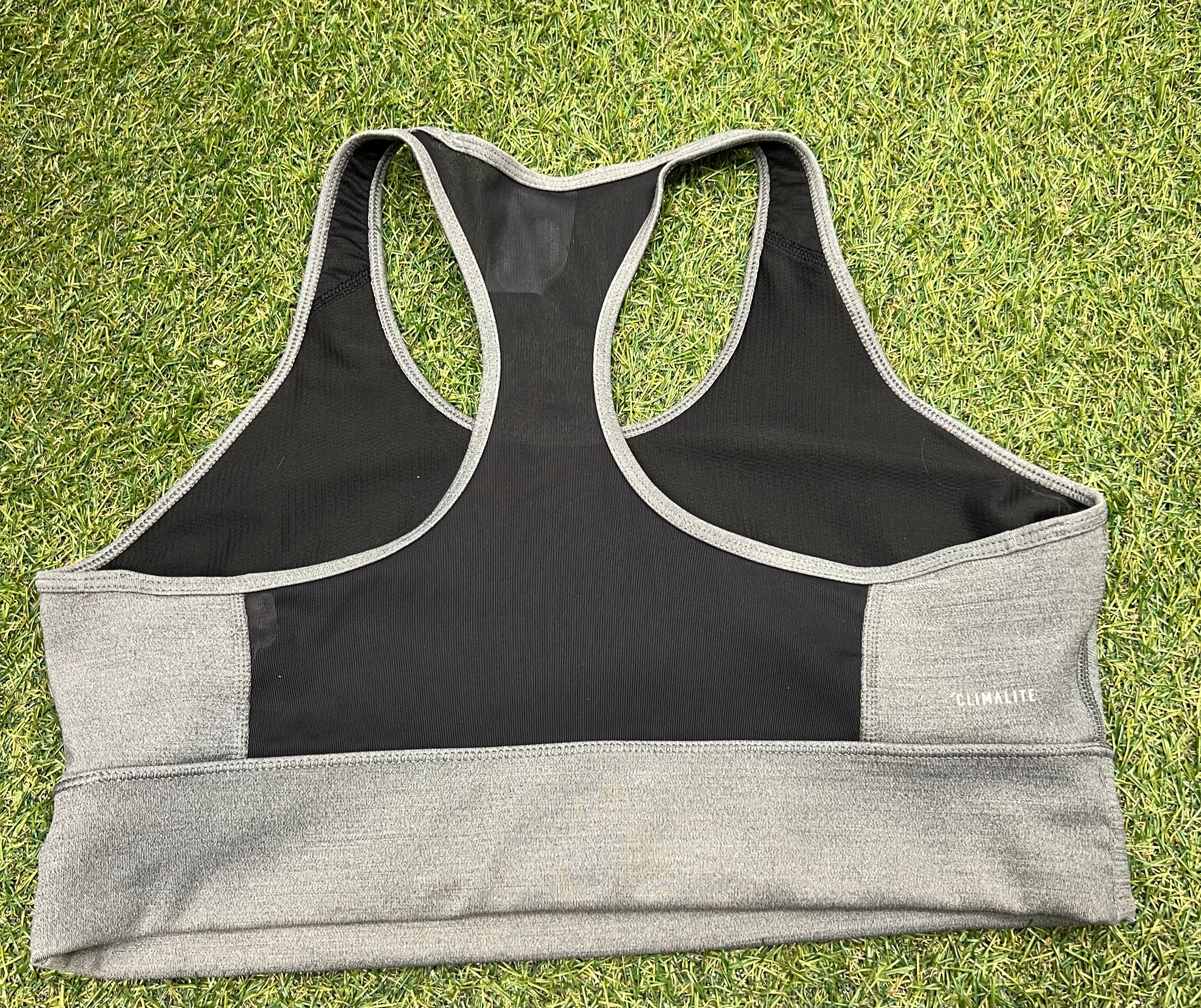 Back view of Adidas sports bra top showing black mesh racerback detail