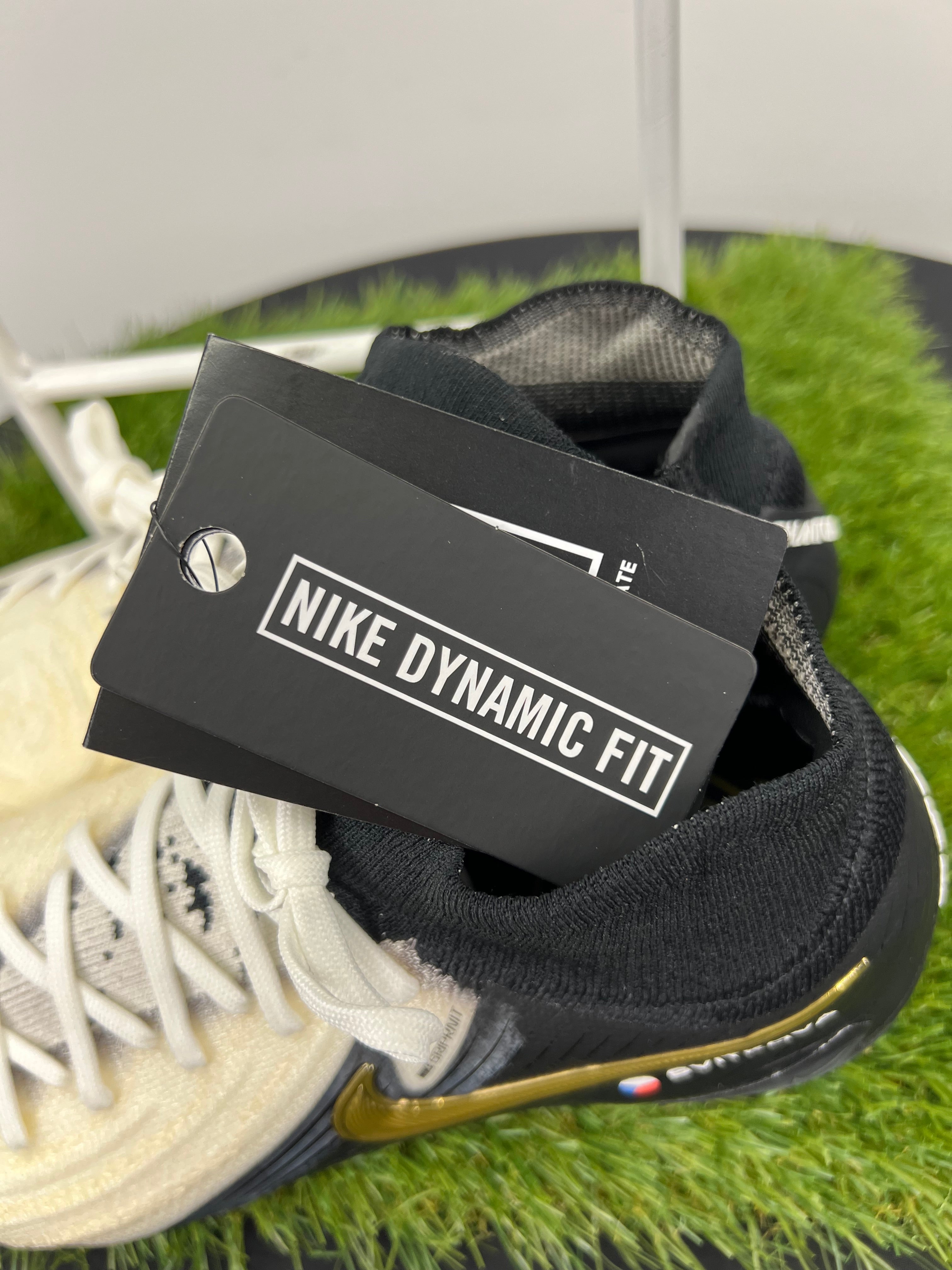 Close-up of Nike Dynamic Fit tag attached to football boots