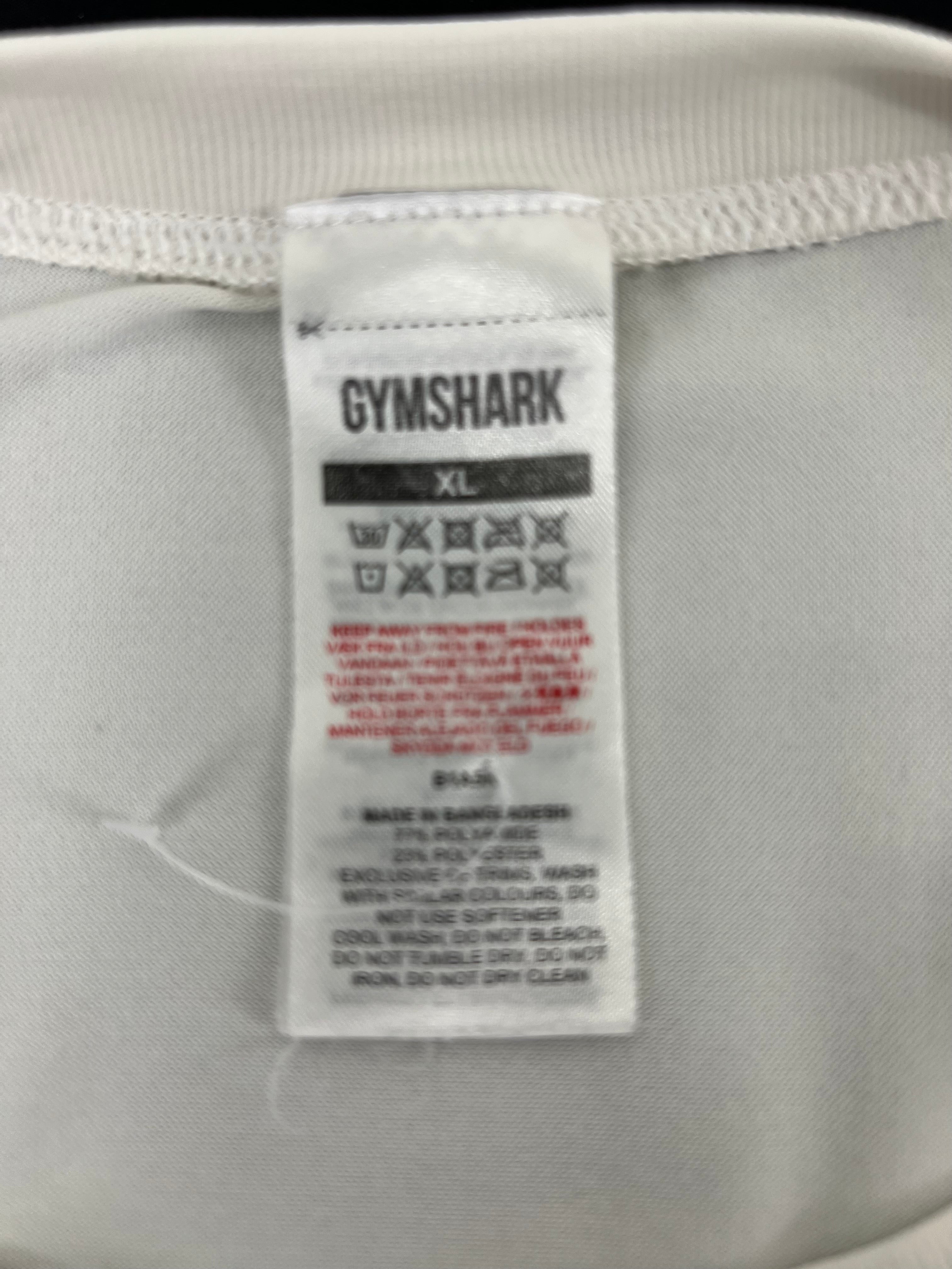 Close-up of Gymshark vest top care and fabric label showing size XL and fabric composition