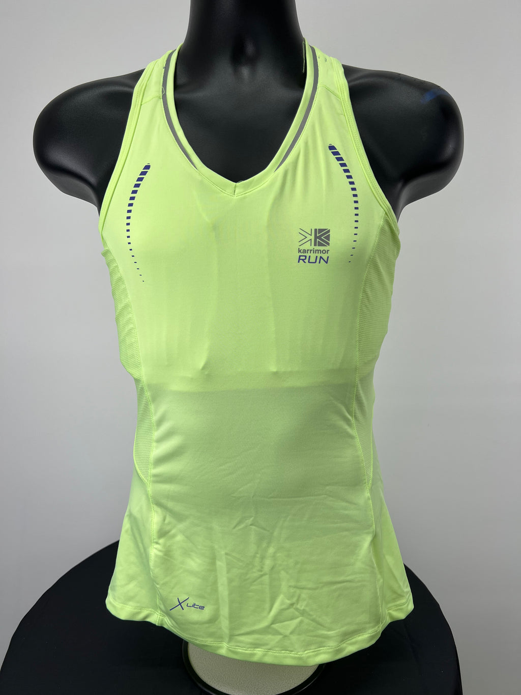 Front view of bright green Karrimor women's running vest top on mannequin