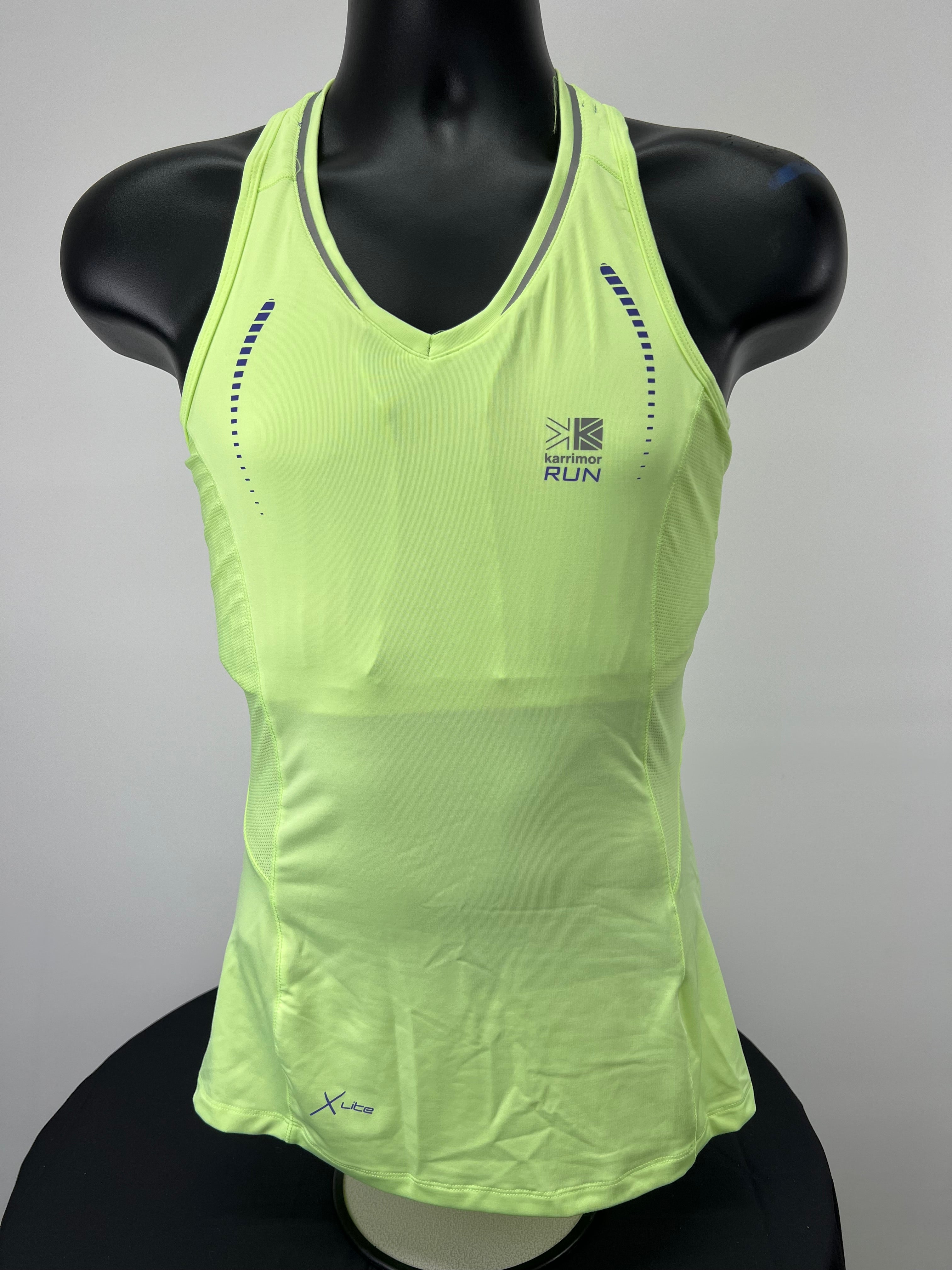 Front view of bright green Karrimor women's running vest top on mannequin