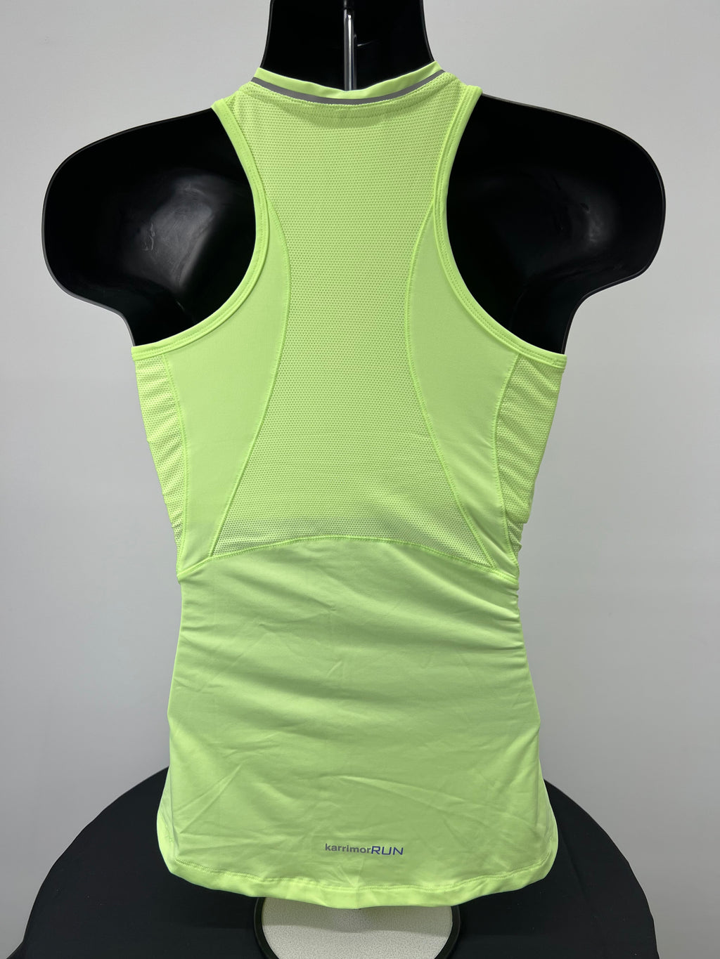Back view of bright green Karrimor women's running vest top showing mesh ventilation panels