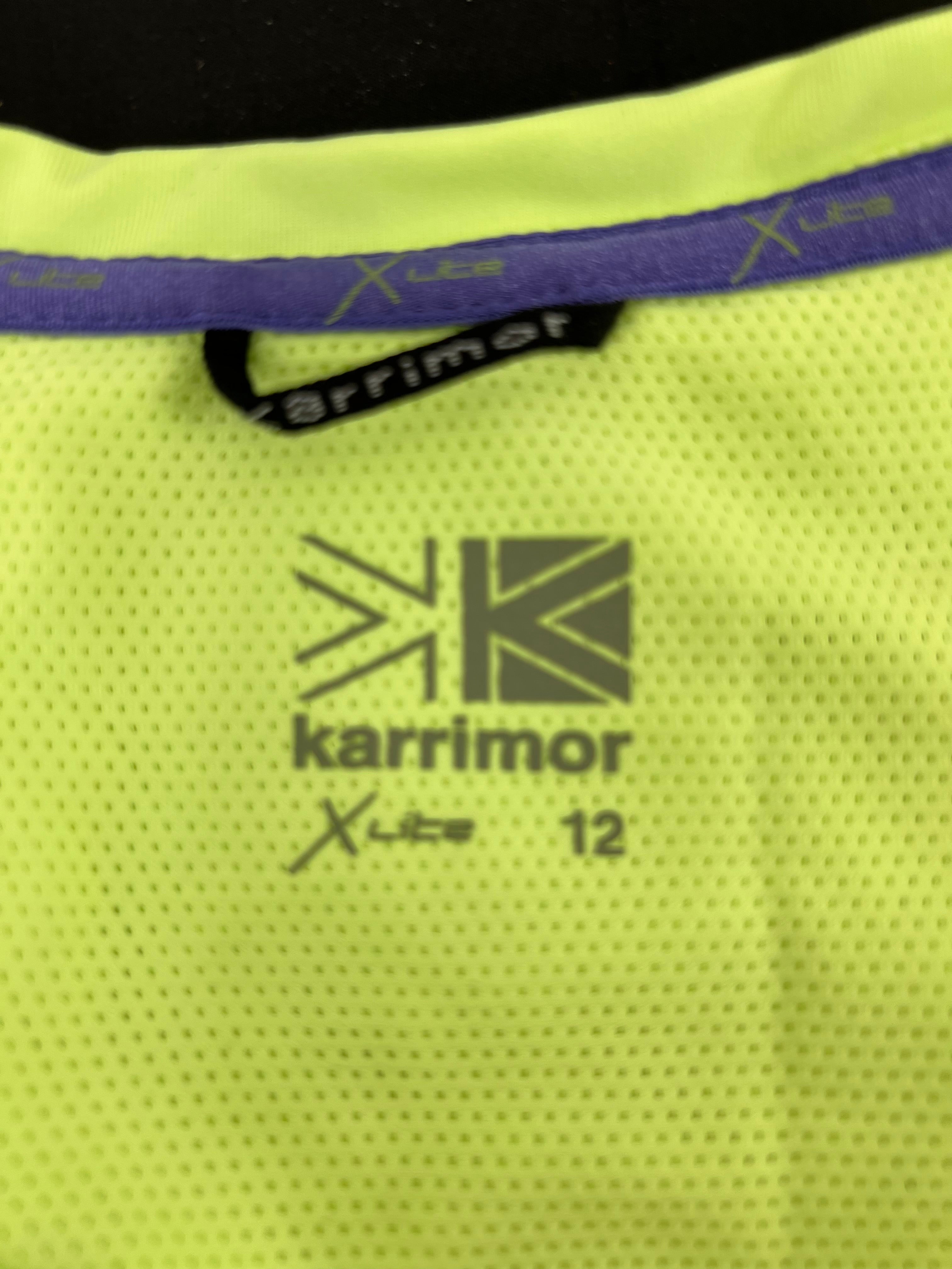 Close-up of inside label with Karrimor logo and size 12 printed on breathable mesh fabric