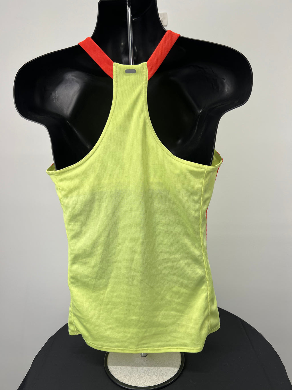 Rear view of Adidas yellow Climalite sports vest showing racerback design and reflective strip