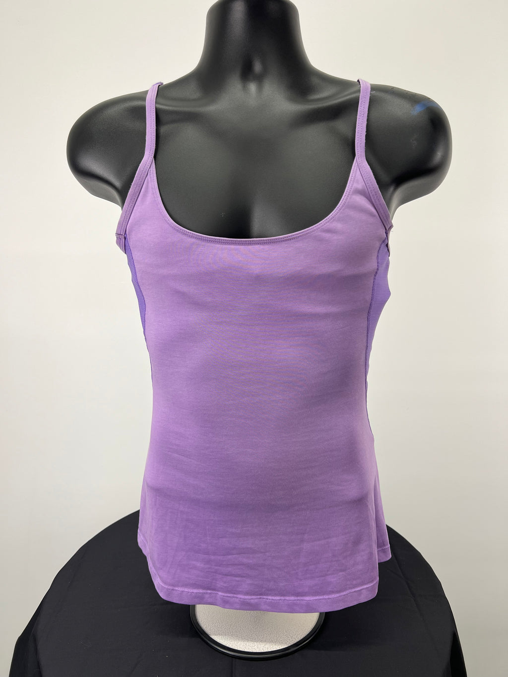 Front view of Nike mauve sports vest with spaghetti straps on display mannequin