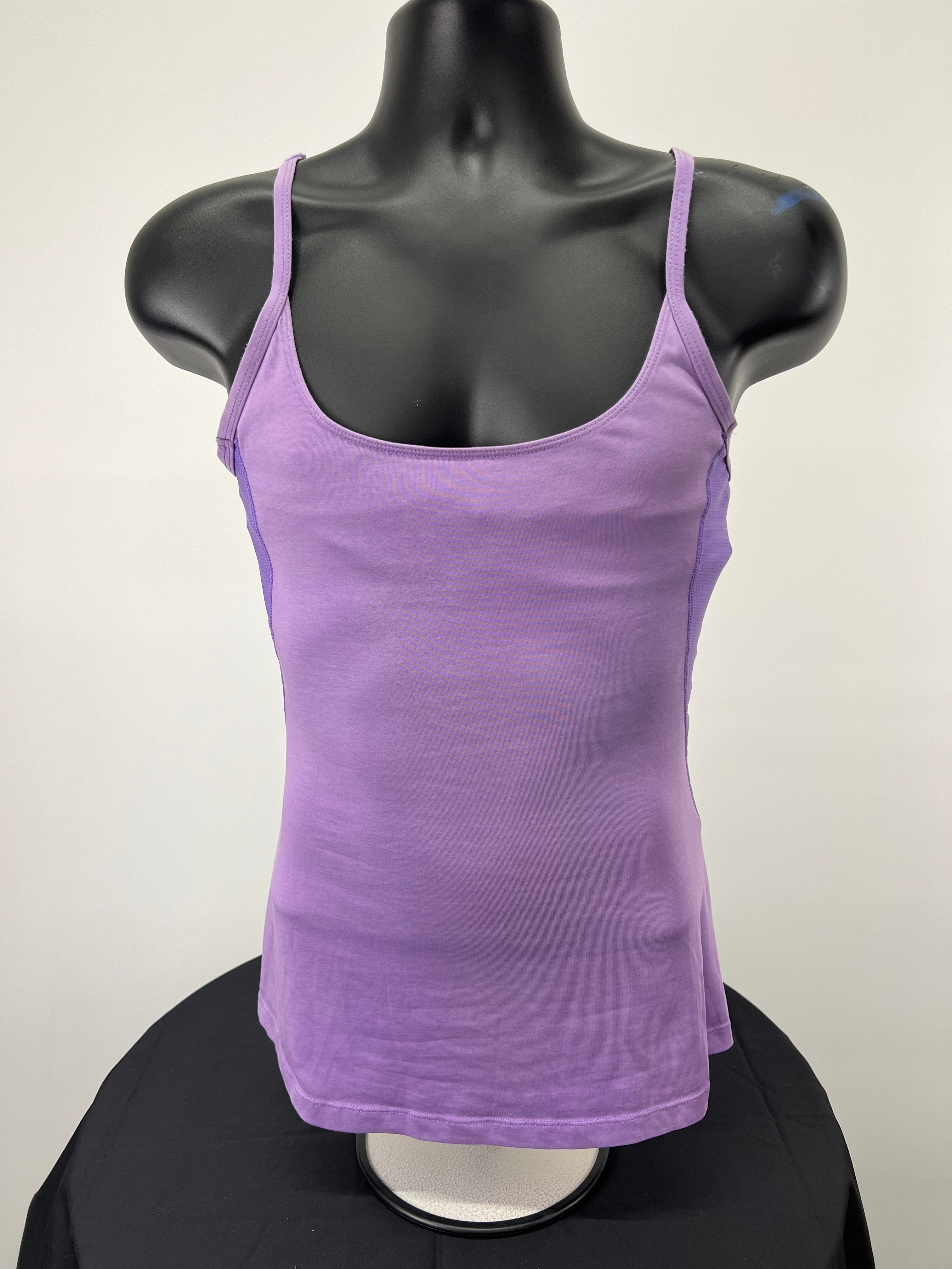 Front view of Nike mauve sports vest with spaghetti straps on display mannequin