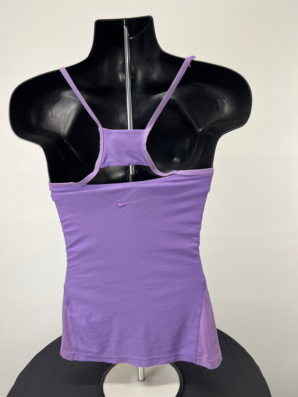 Back view of Nike mauve sports vest showing breathable mesh panel and fine stitching