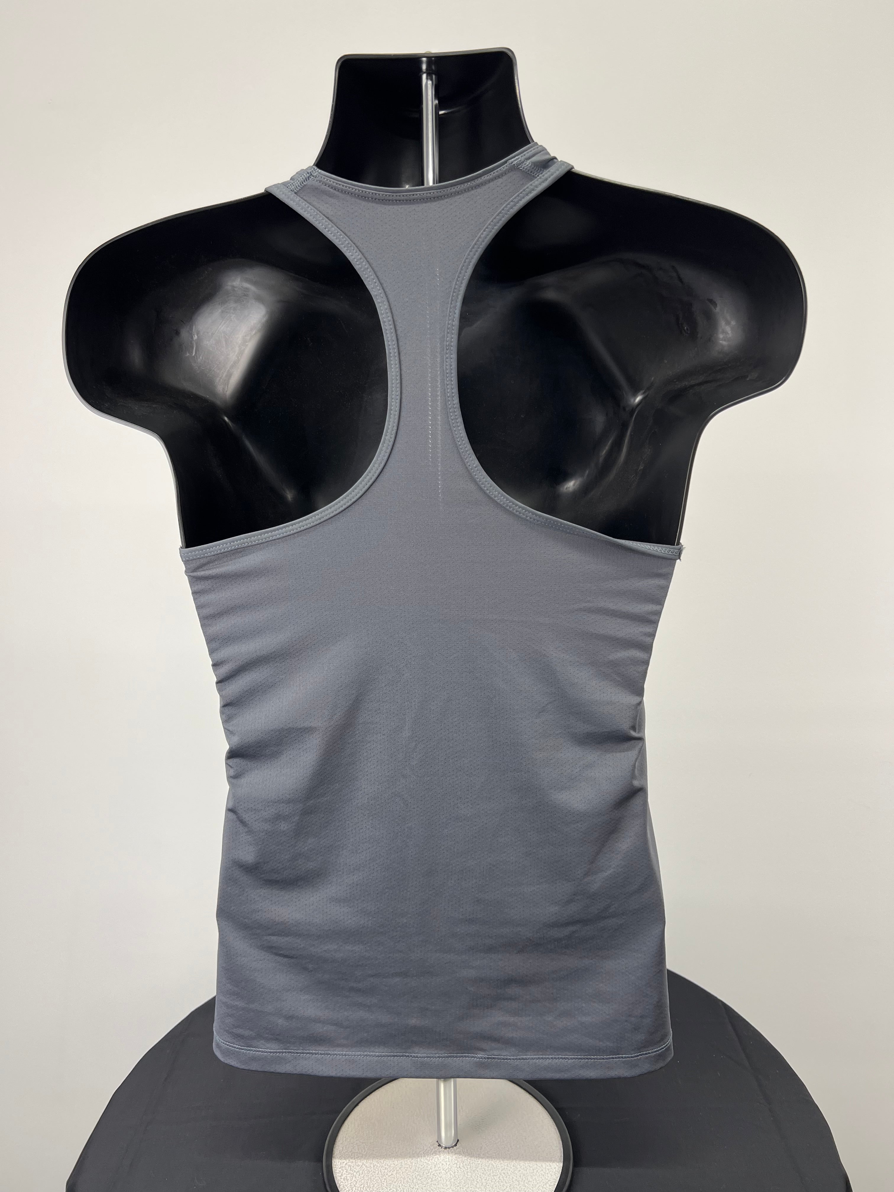 Back view of Nike Dri-Fit grey racerback sports vest on mannequin highlighting racerback design