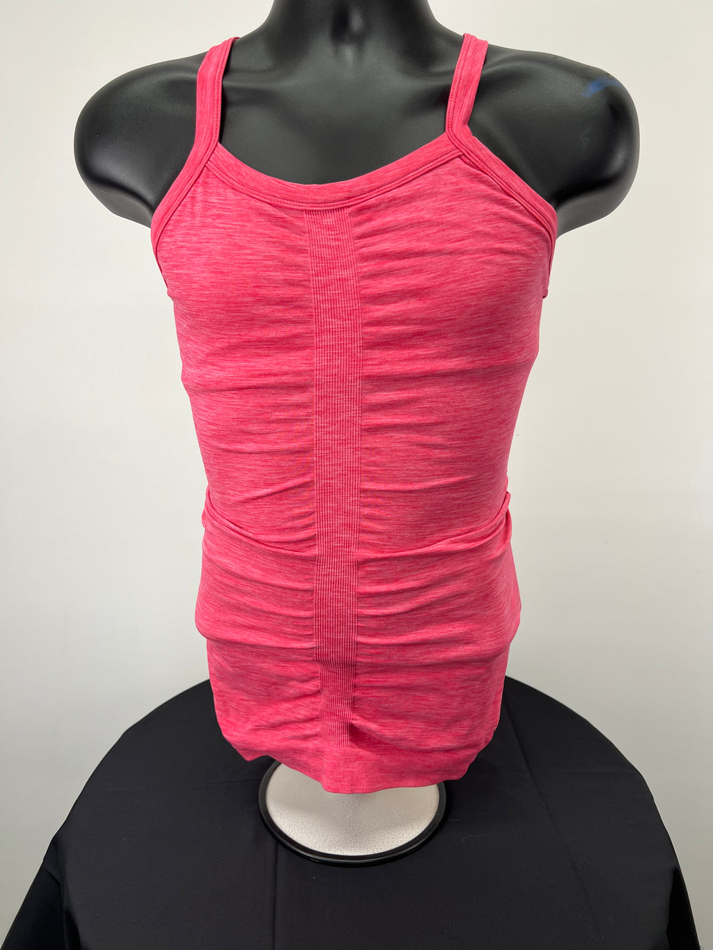 Front view of pink Sweaty Betty elasticated vest top on mannequin