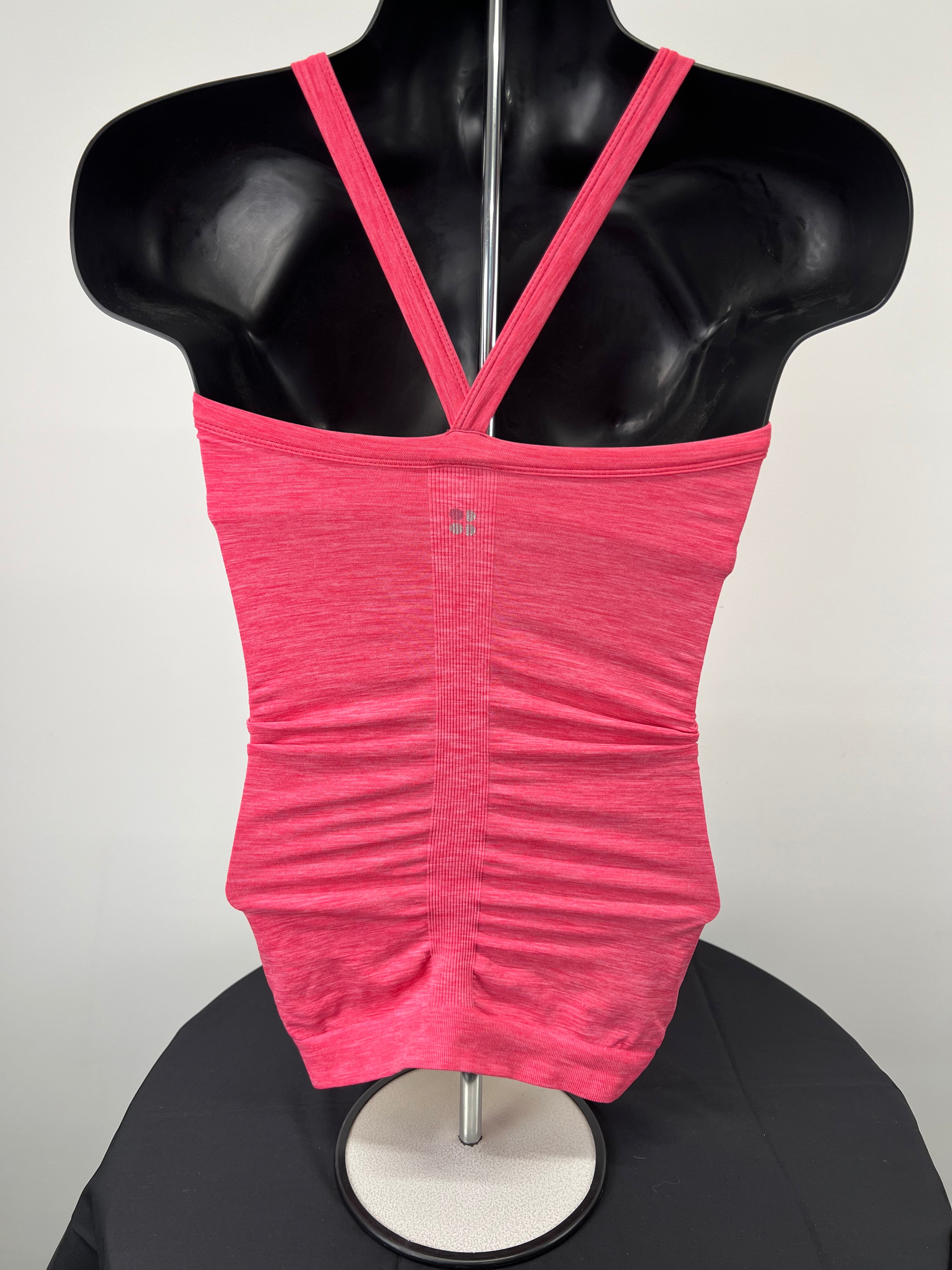 Back view of pink Sweaty Betty elasticated vest top showing thin straps