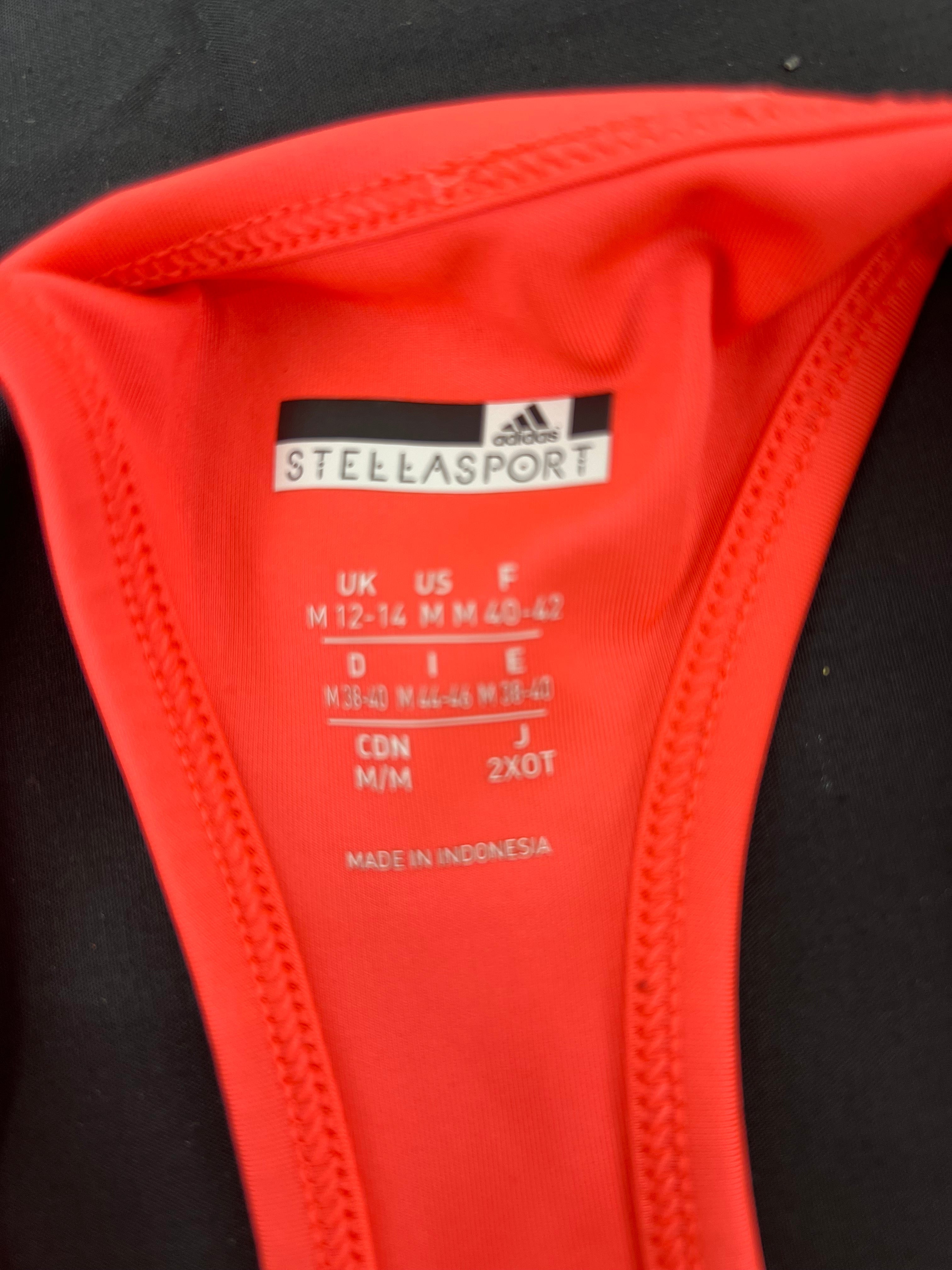 Inside label showing adidas Stella McCartney brand and clothing size medium M