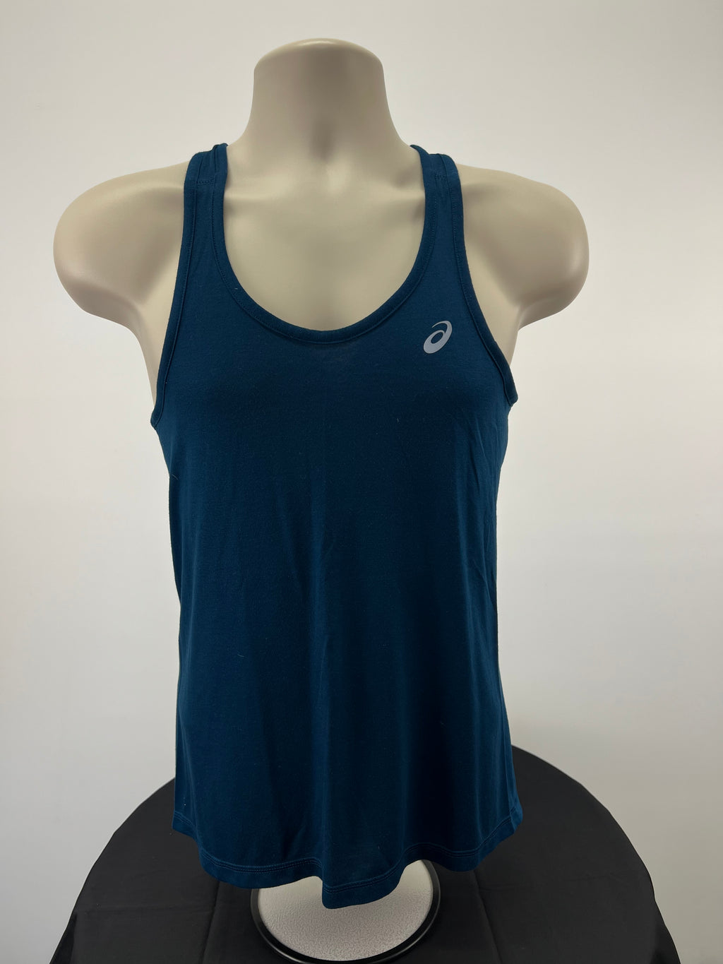 Front view of Asics blue running vest top on mannequin showing scoop neckline