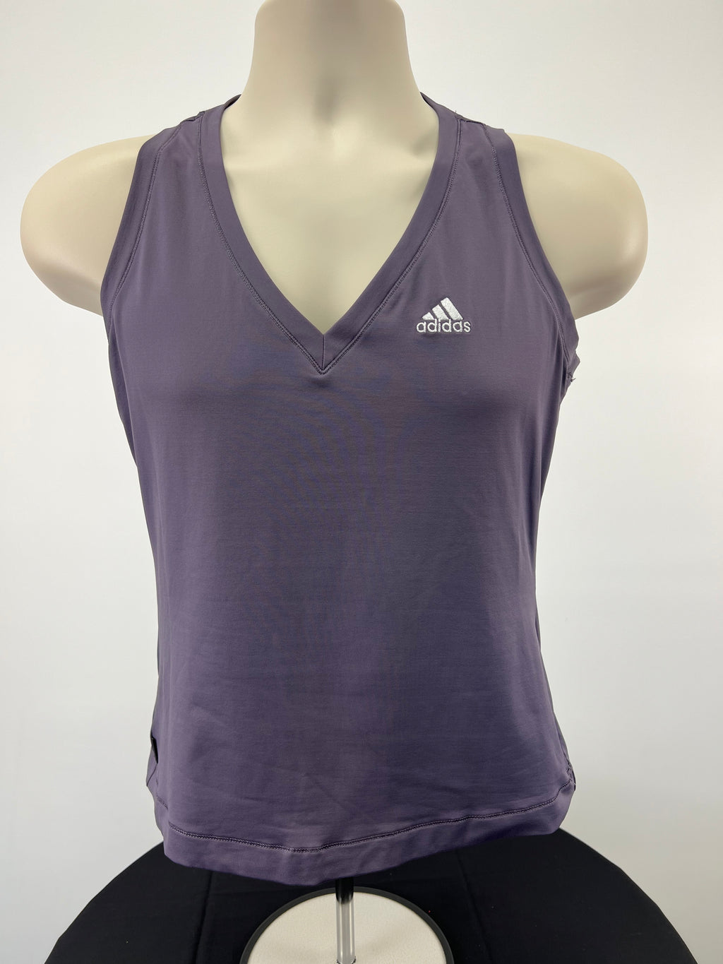 Front view of adidas mauve sleeveless v neck vest top on mannequin