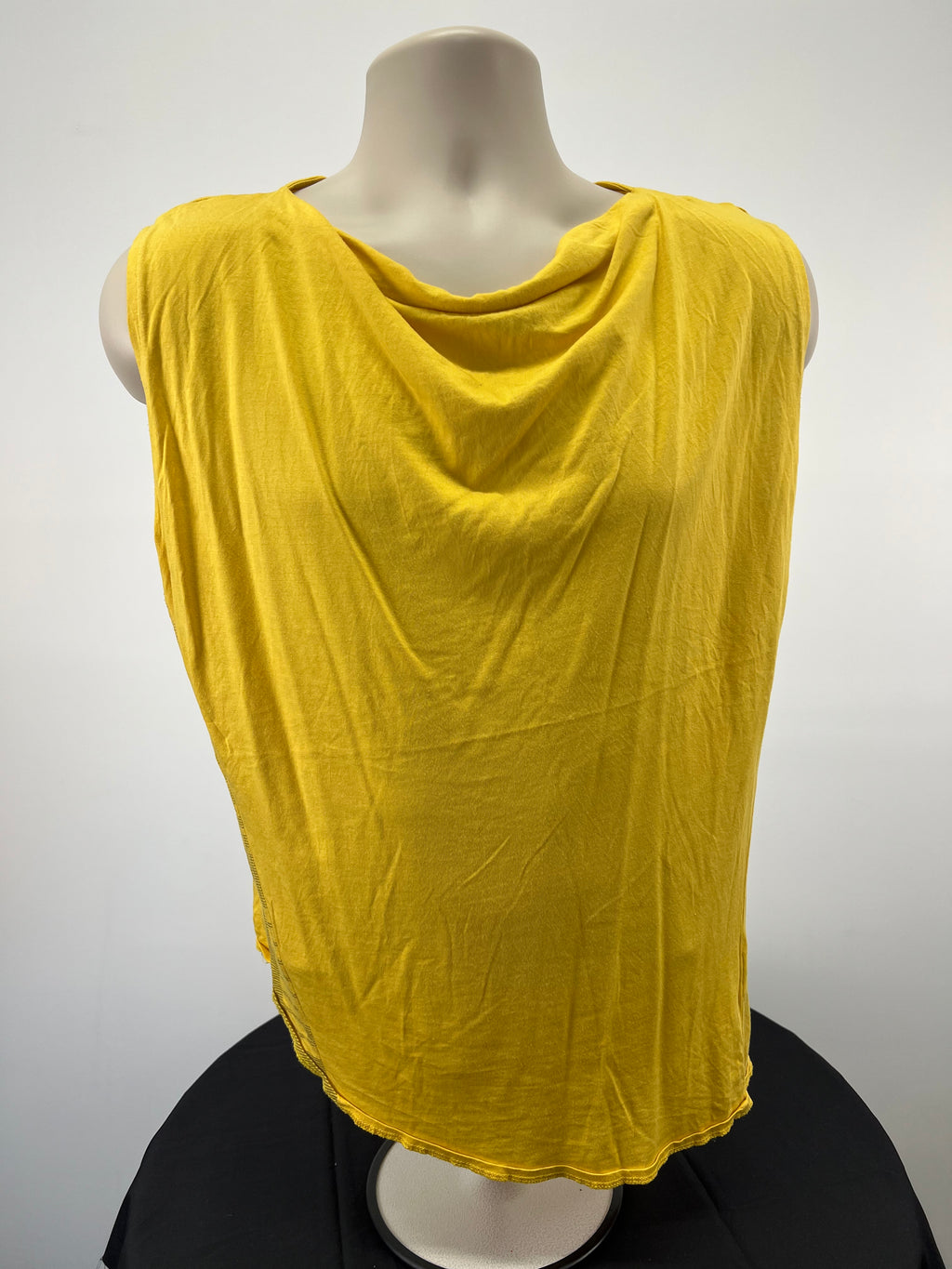 Front view of Puma x Hussein Chalayan sleeveless yellow top with draped neckline on mannequin