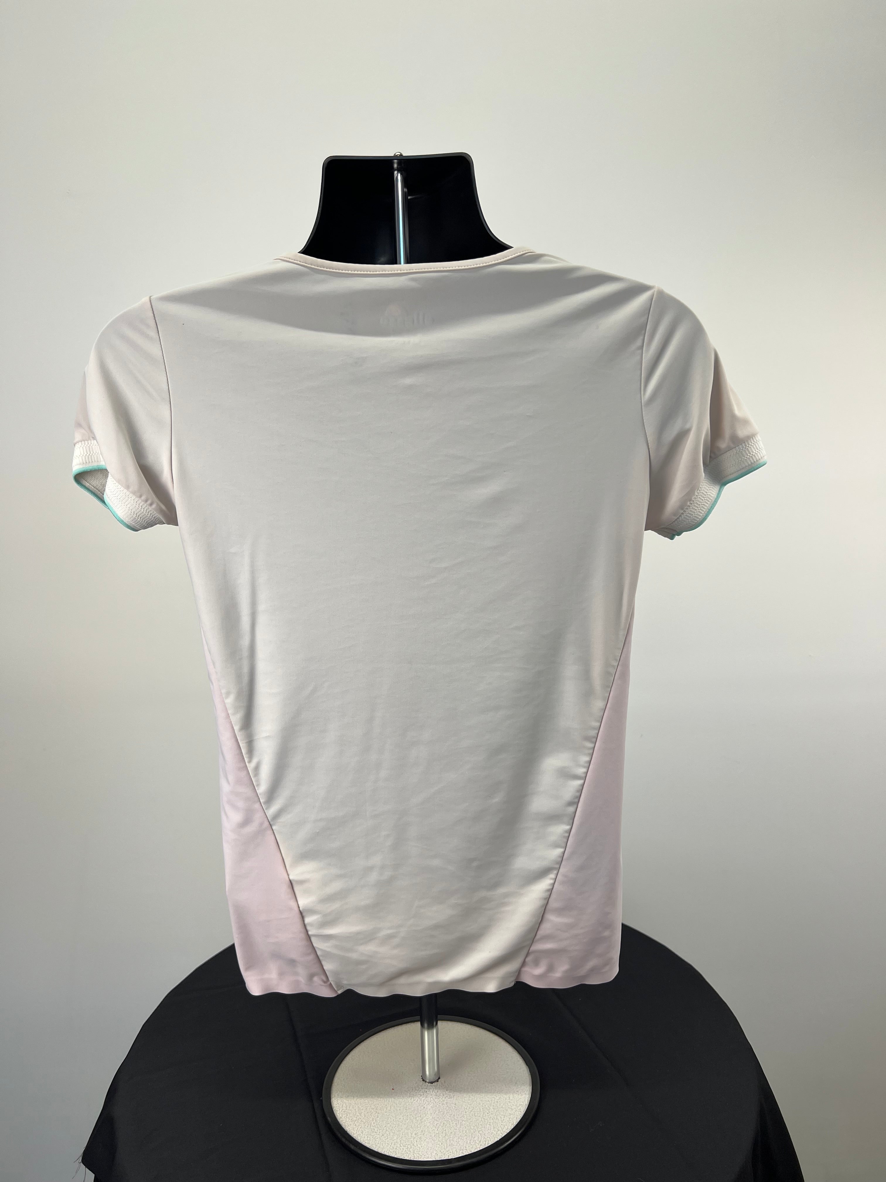 Back view of Ellesse women's short sleeve V-neck t-shirt showing plain off-white fabric and blush panels