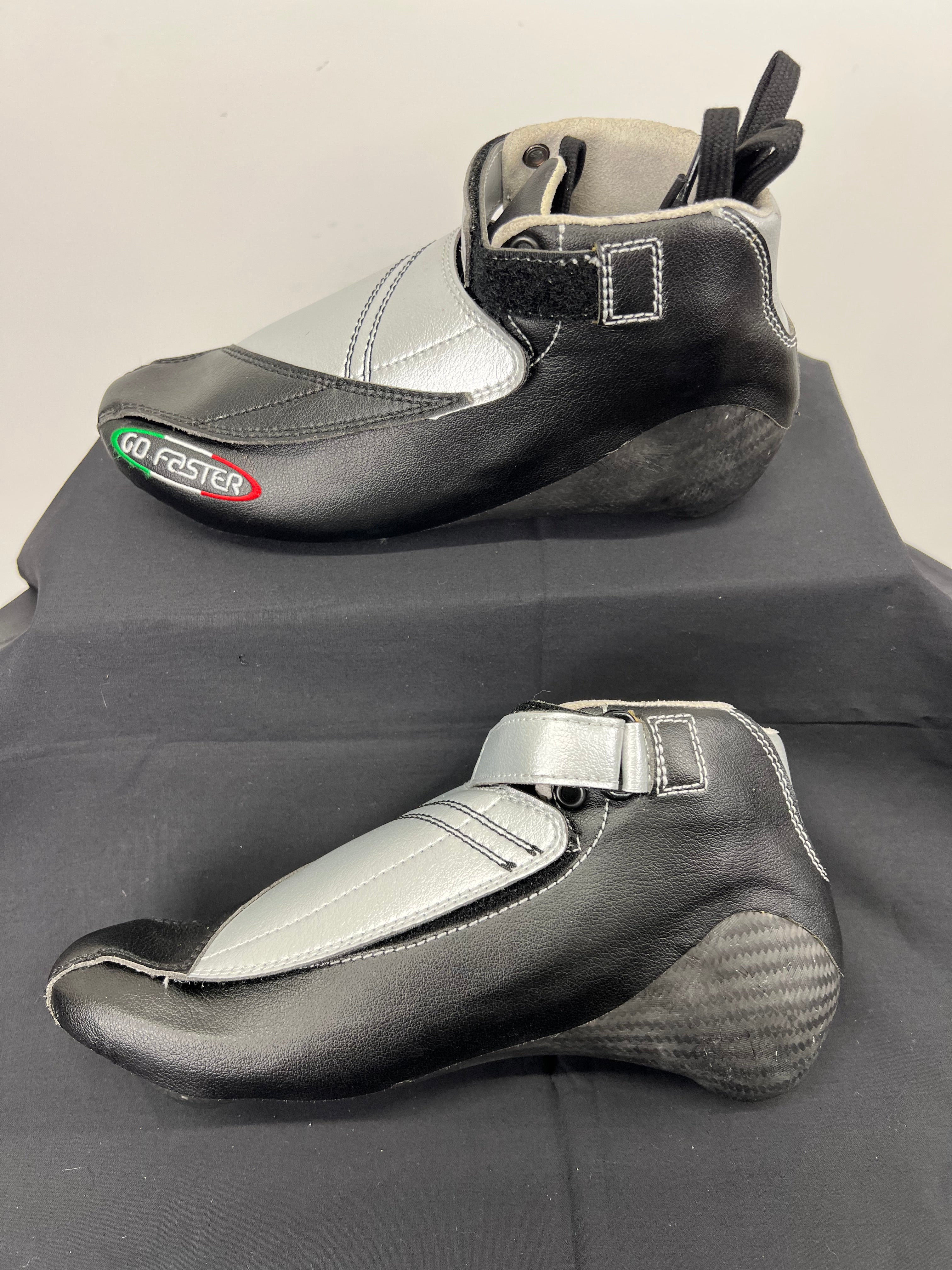 Opposite side view of Go Faster short track speed skating boot size 37 with carbon fibre heel and silver top panels