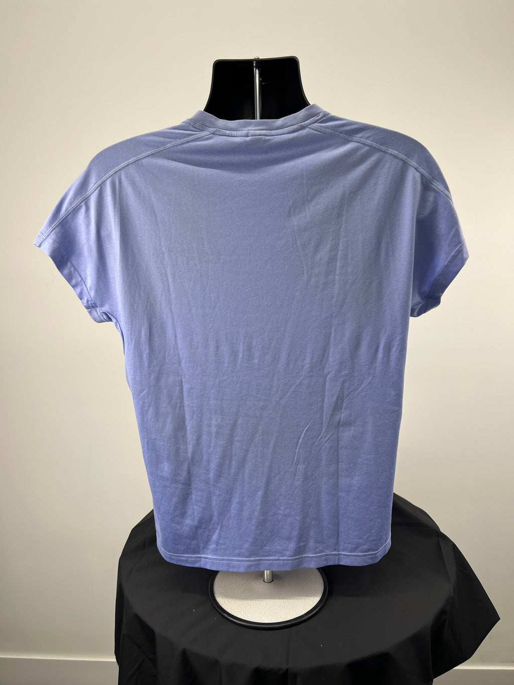 Back view of Adidas soft blue V-neck t-shirt showing plain design