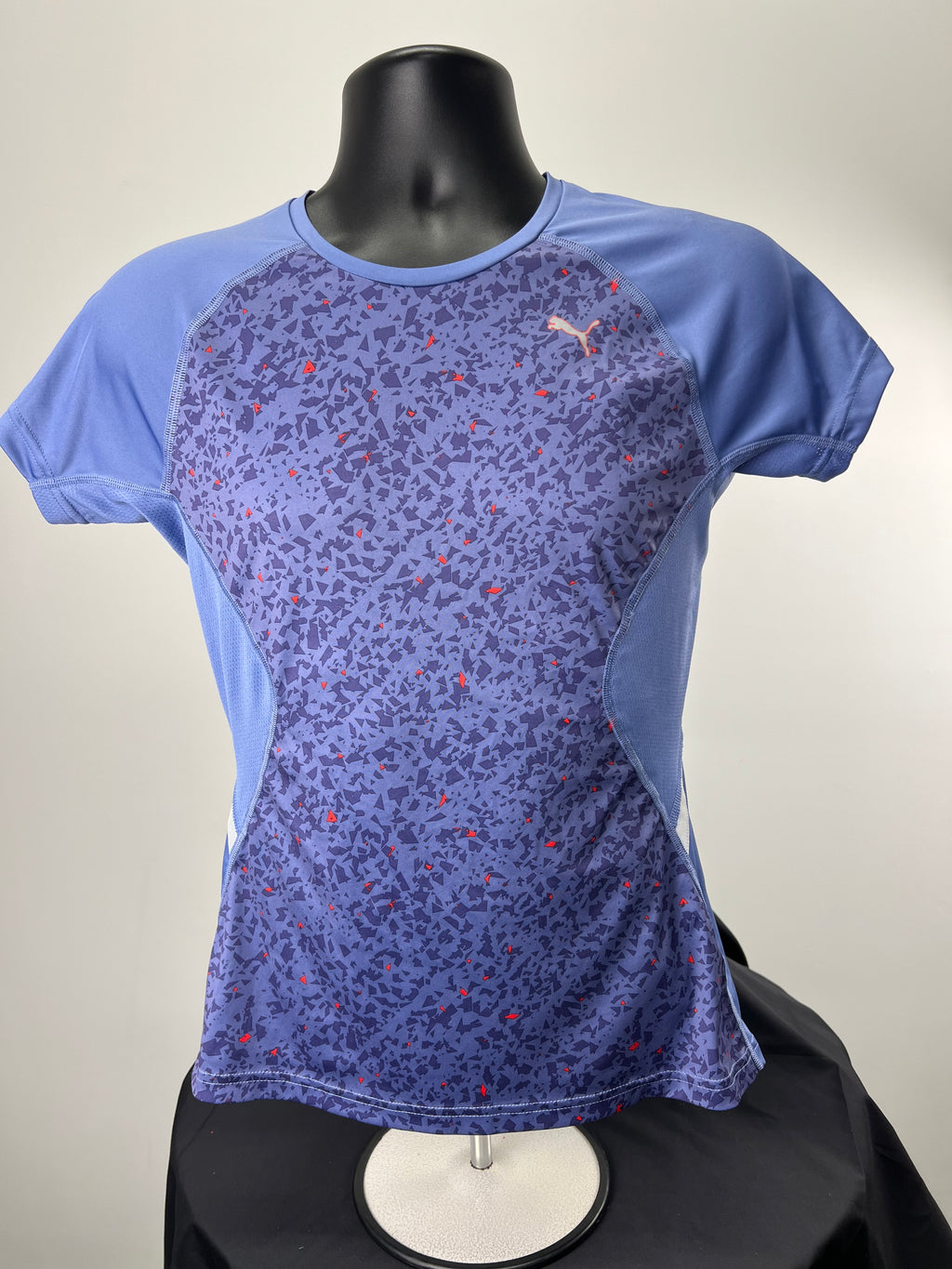 Front view of Puma purple patterned women's sport T-shirt on mannequin