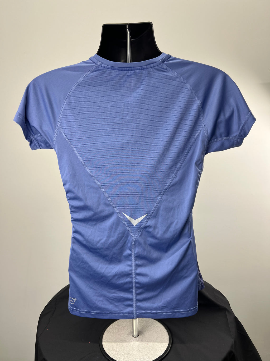 Back view of Puma purple women's sport T-shirt showing mesh ventilation panel