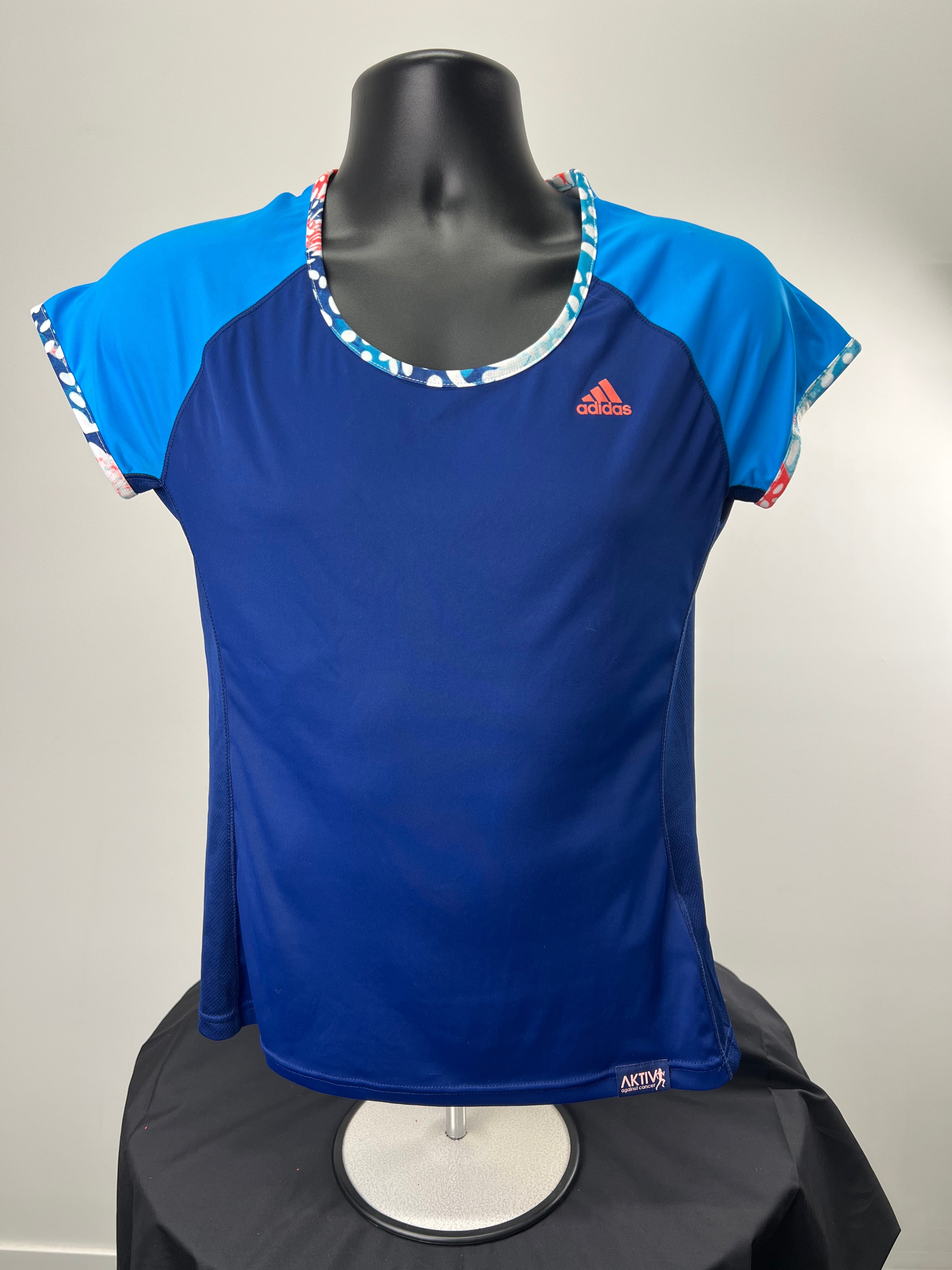 Front view of Adidas women's running t-shirt in navy blue with bright blue raglan sleeves and patterned trim