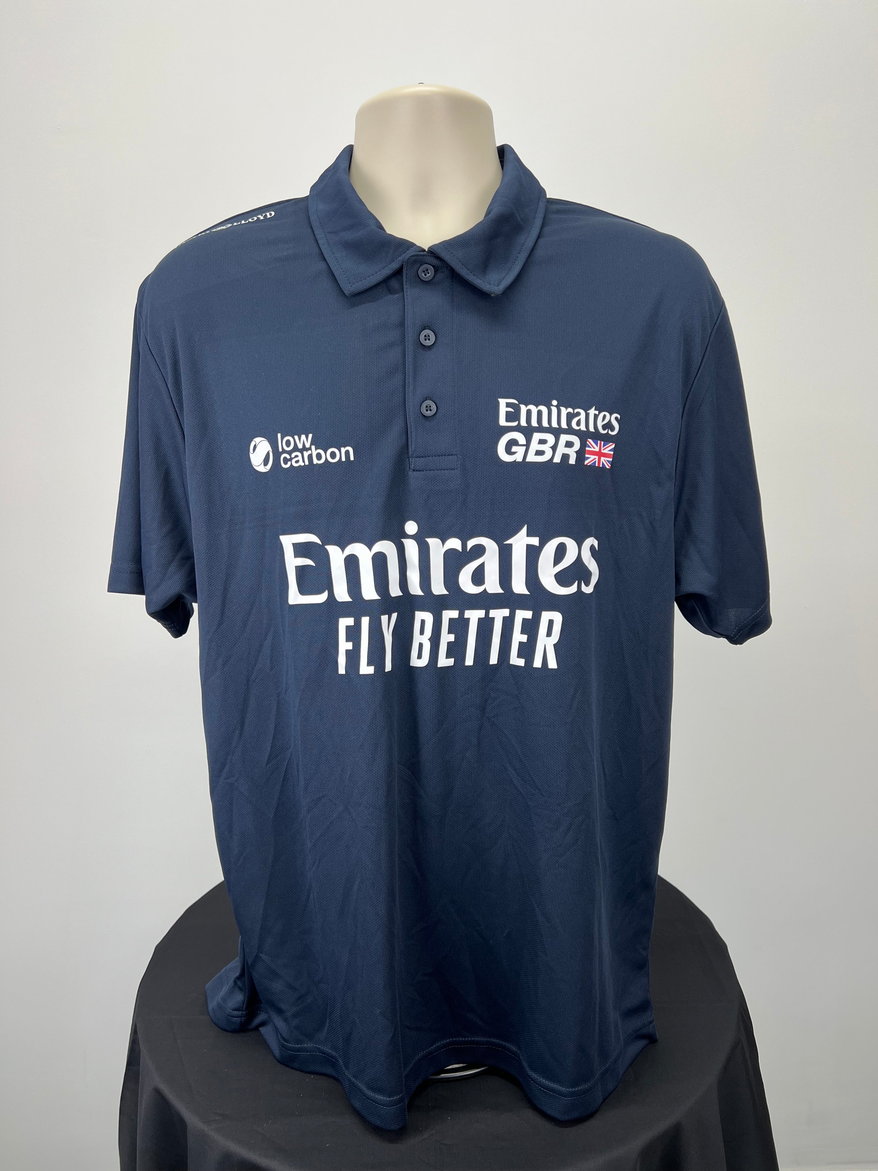 Front view of men's navy Emirates GBR x Henri Lloyd polo shirt with logos and button collar