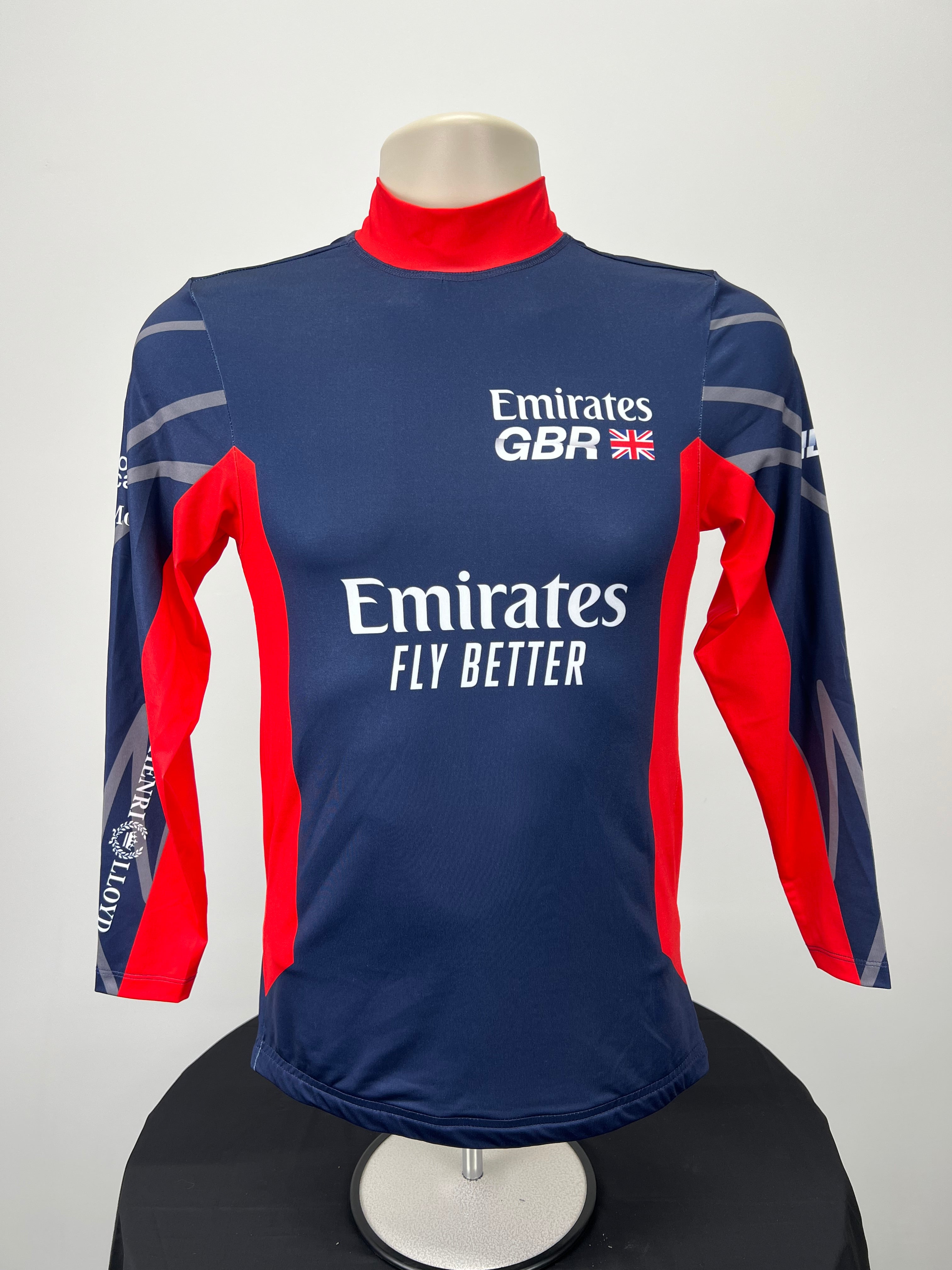 Front view of Emirates Team GBR SailGP rash vest in navy and red with Emirates Fly Better logo
