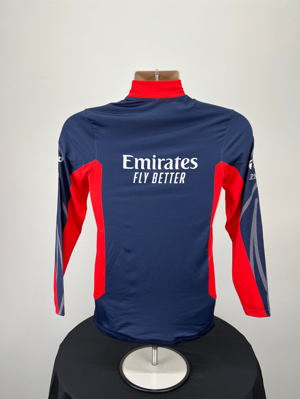 Back view of Emirates Team GBR SailGP rash vest featuring Emirates Fly Better logo
