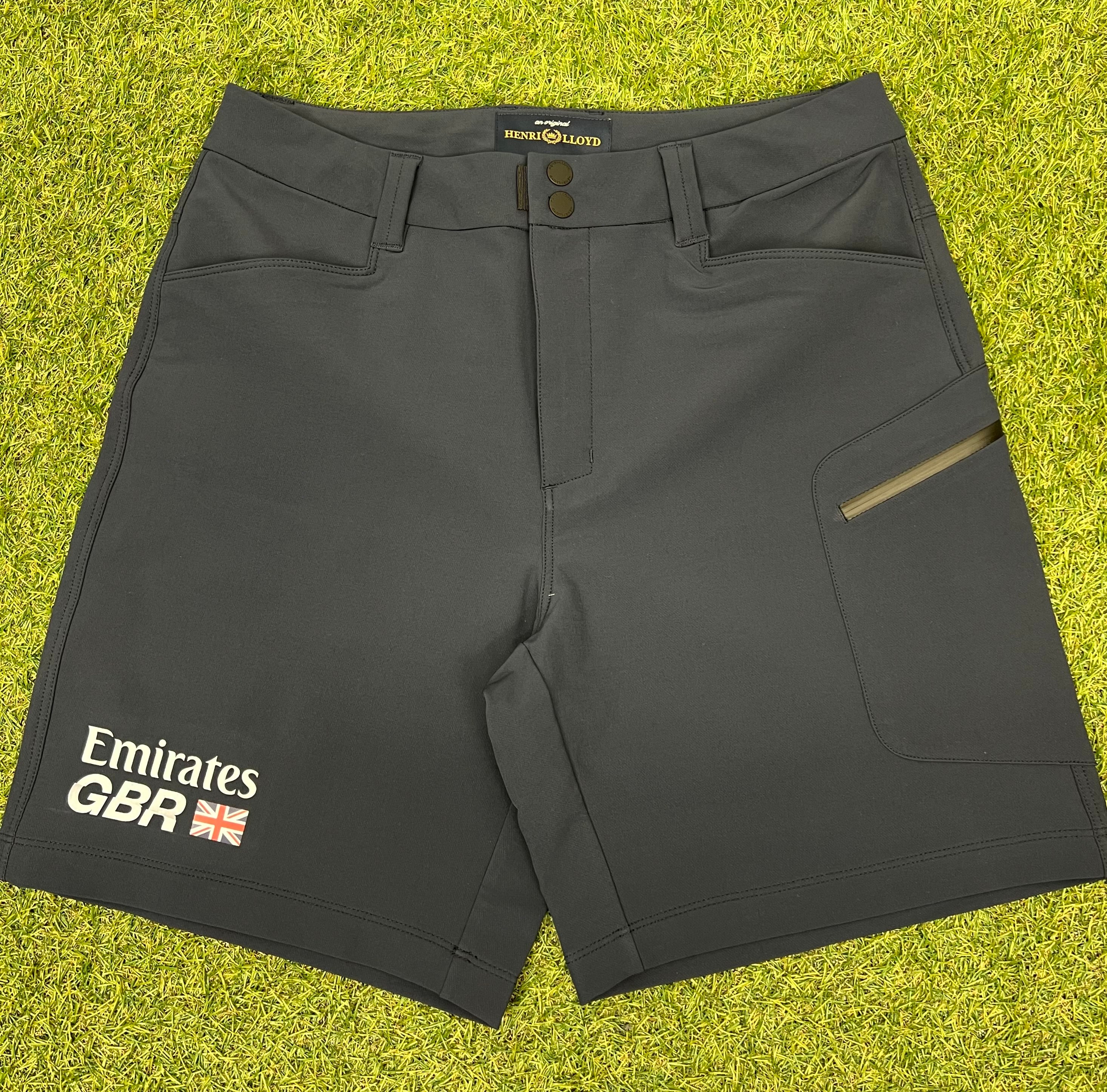 Front view of navy women's explorer shorts by Emirates X Henri Lloyd showing pockets and Emirates GBR logo