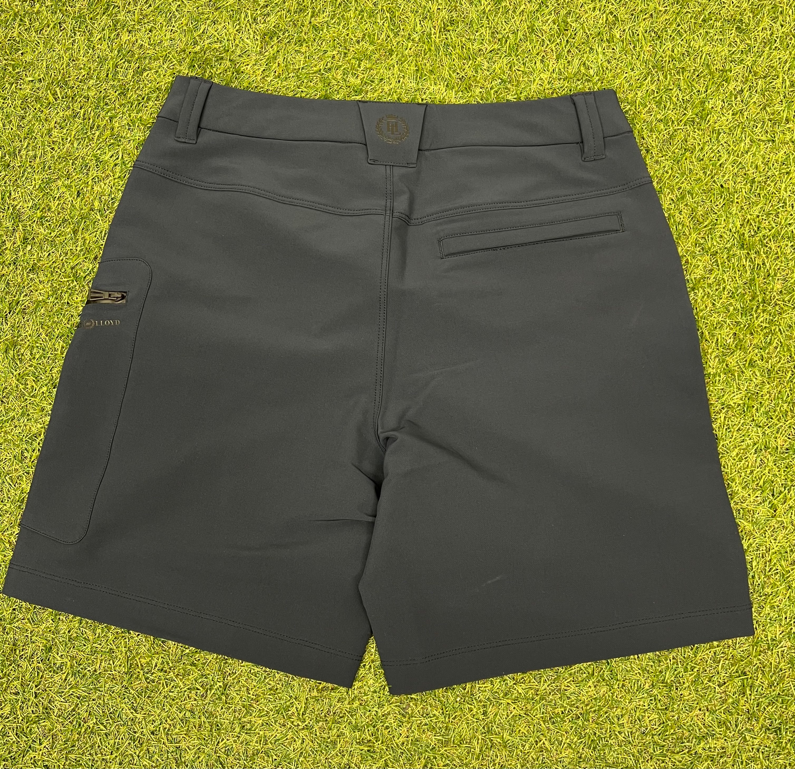 Back view of navy women's explorer shorts showing zipped pocket and Henri Lloyd logo tag