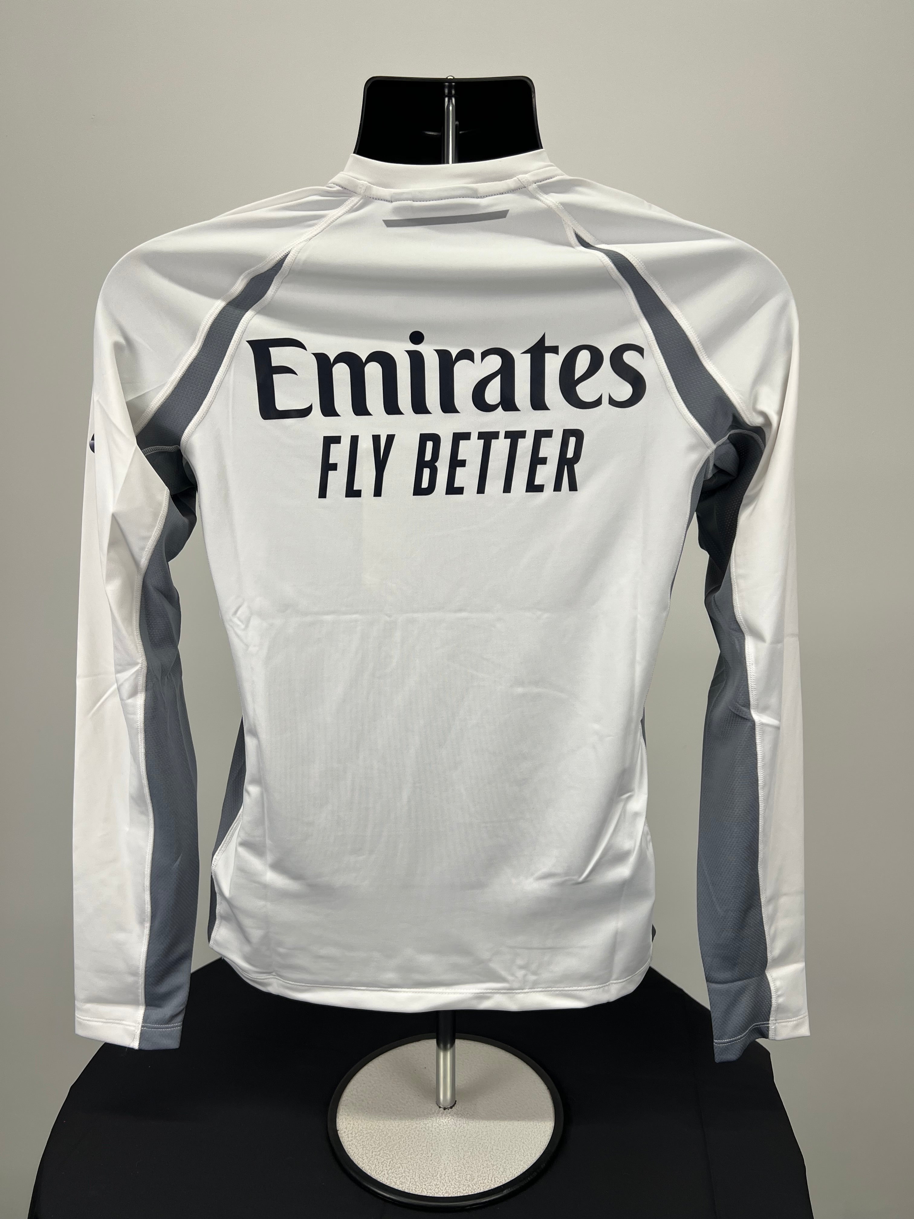 Rear view of Emirates x Henri Lloyd women's white long sleeve DriFast tee showing Emirates Fly Better branding and grey mesh panels