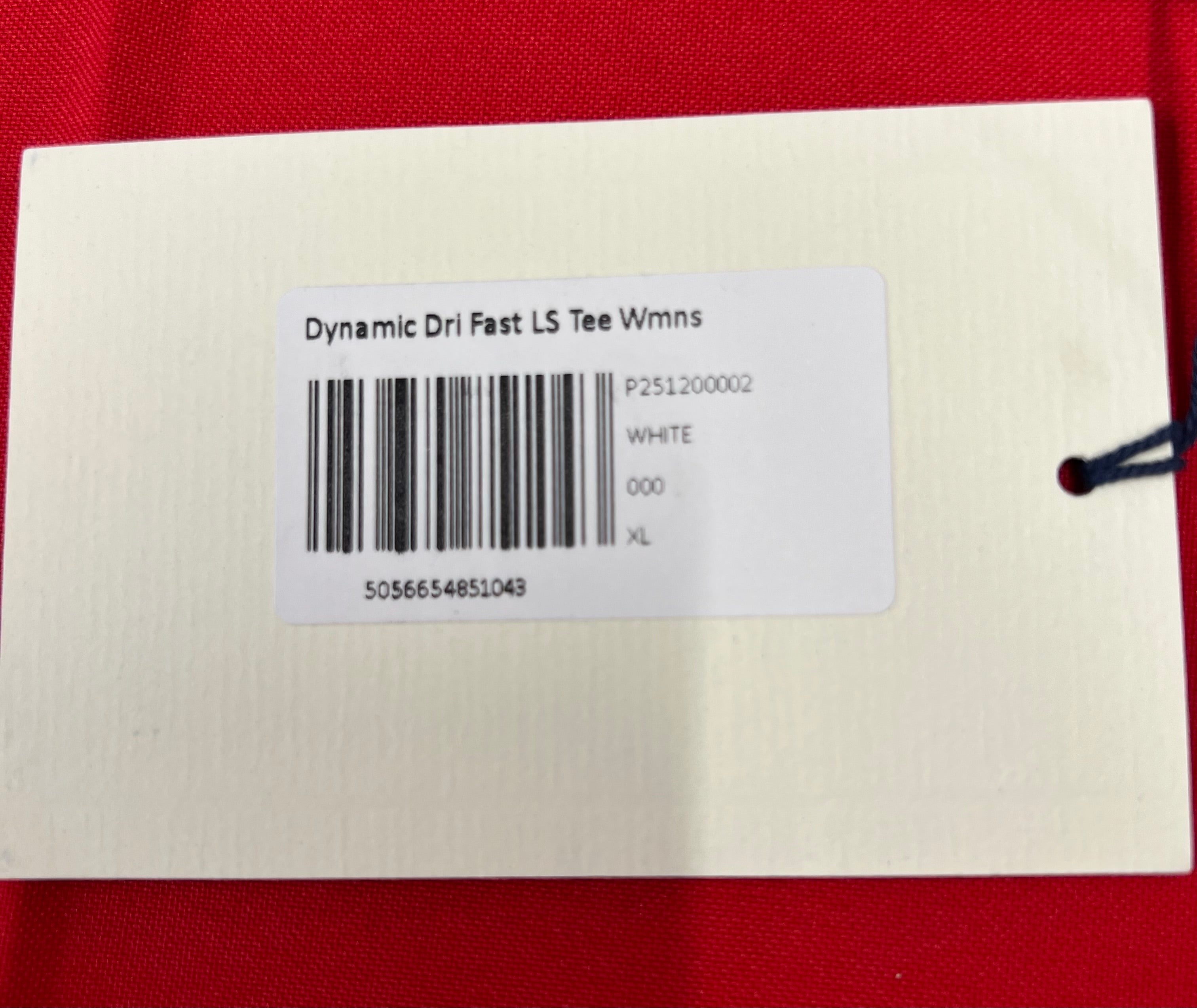 Close-up of white product label tag showing Dynamic Dri Fast LS Tee Womens size XL barcode