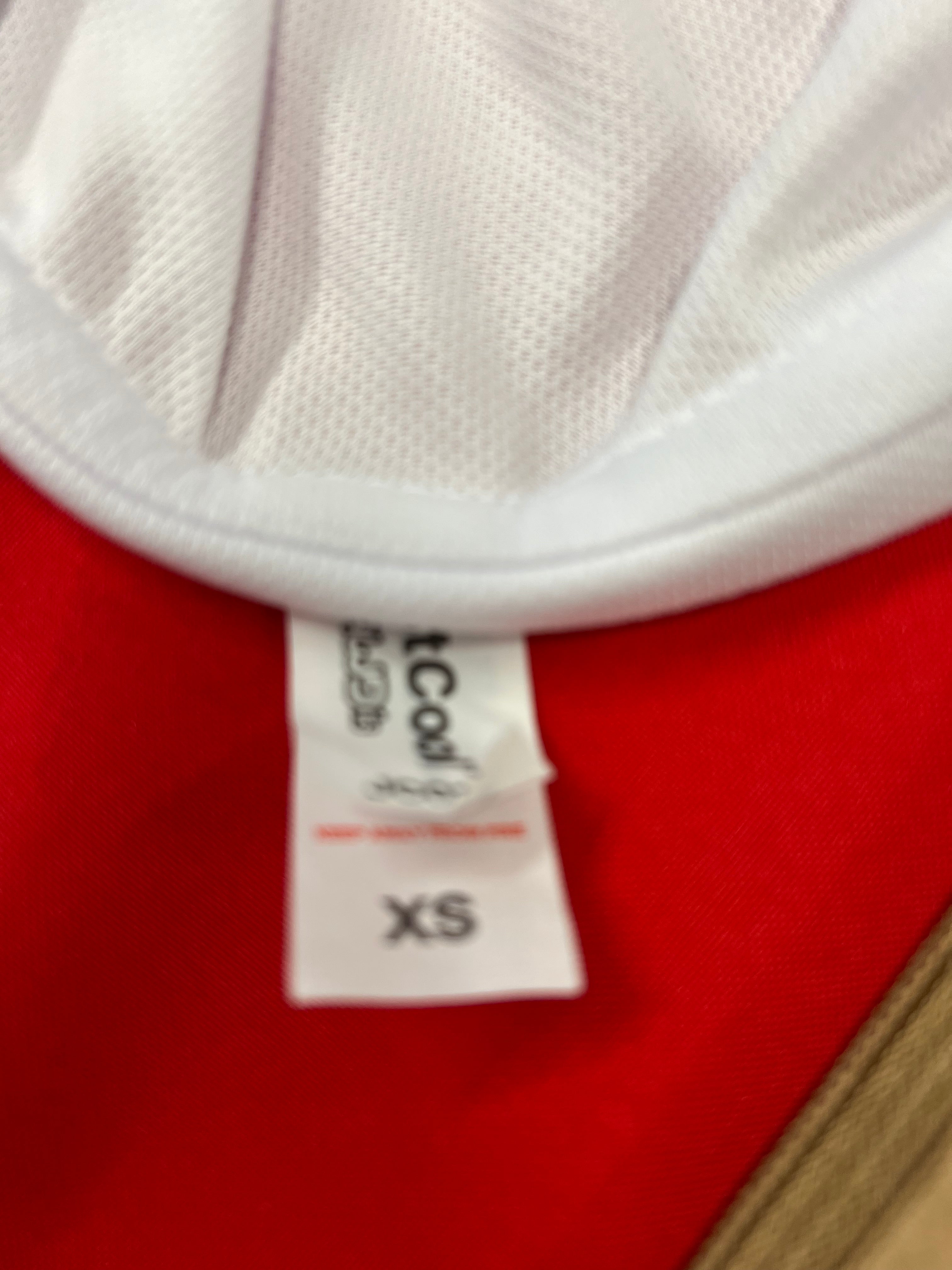 Close-up of the inner neck label showing wash and size XS on the Emirates Team GBR x Henri Lloyd fast dri tee