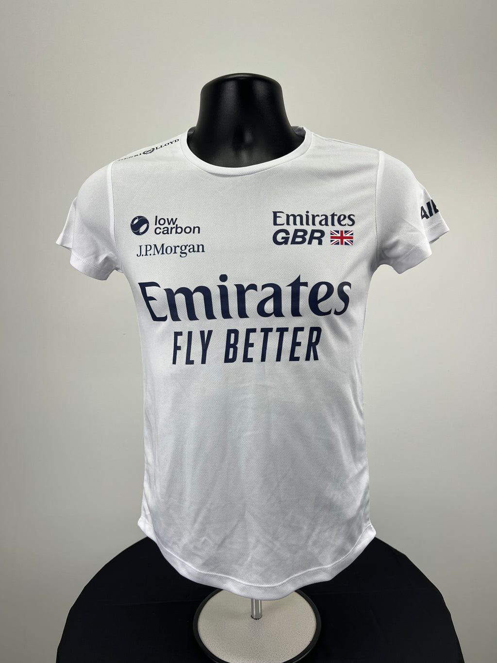 Front view of Women's Emirates Team GBR x Henri Lloyd white short sleeve top with logos
