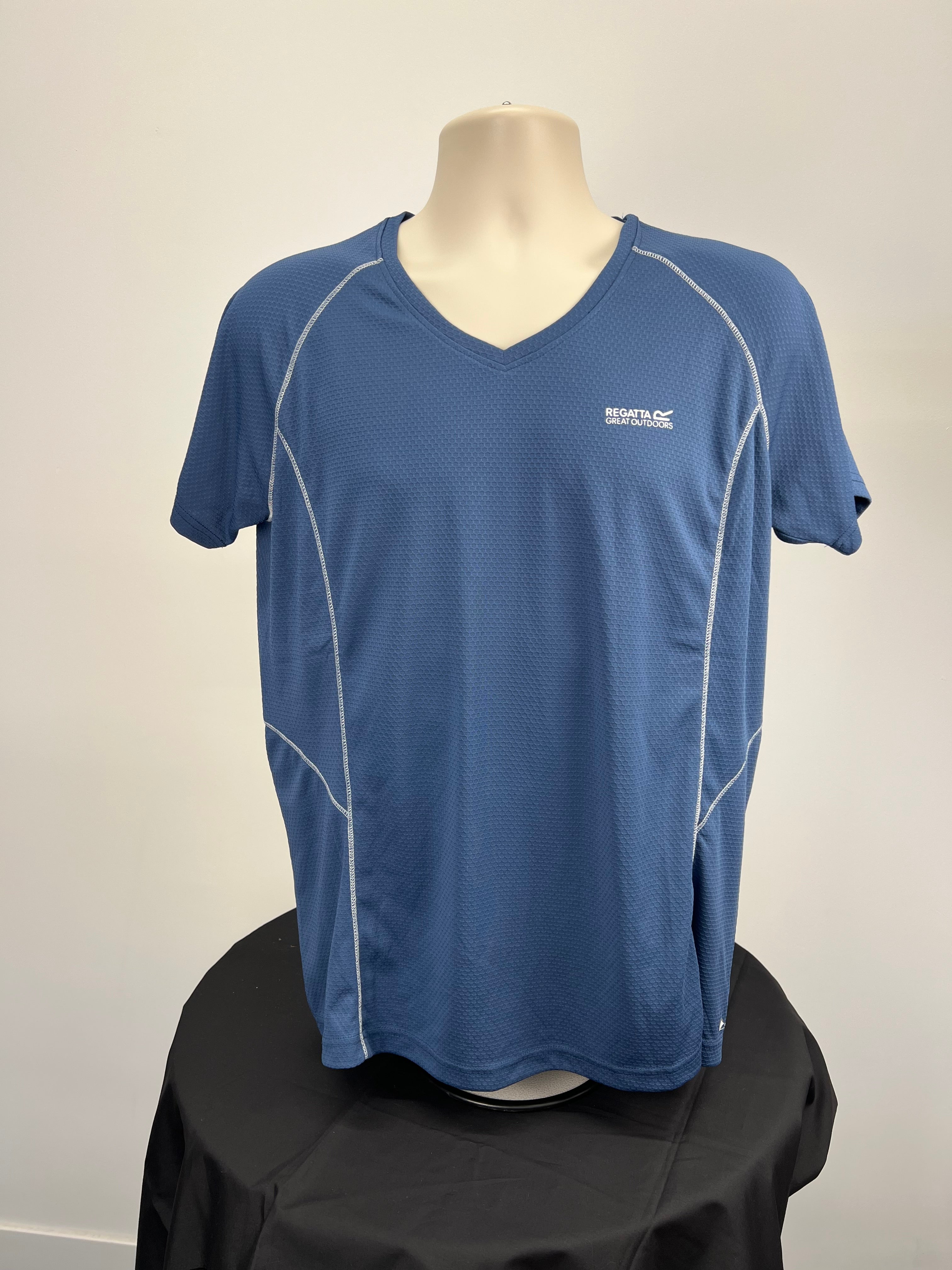 Front view of women's blue Regatta V-neck t-shirt on mannequin showing white contrast stitching