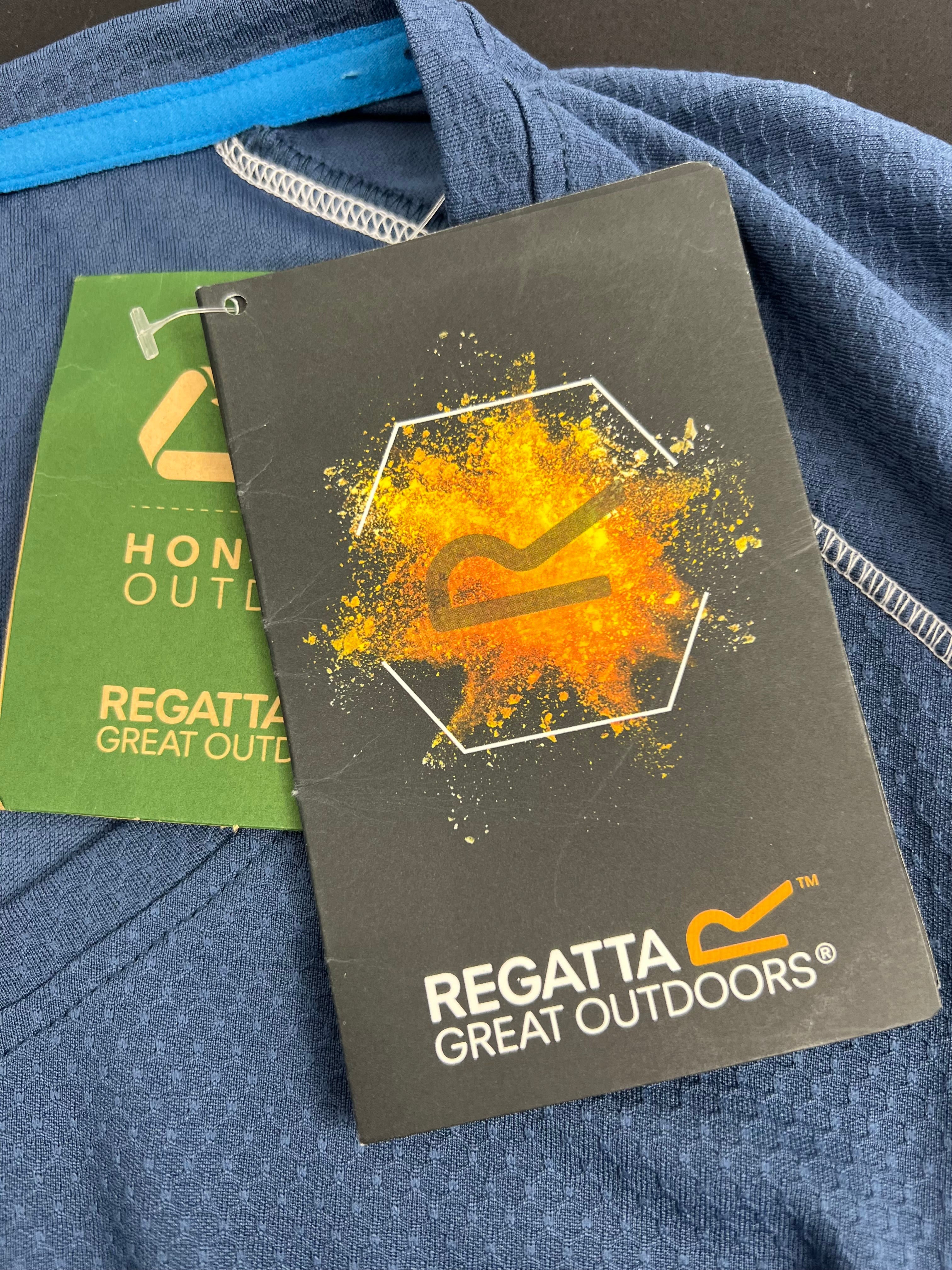 Close-up of Regatta Great Outdoors brand tags attached to the blue V-neck t-shirt