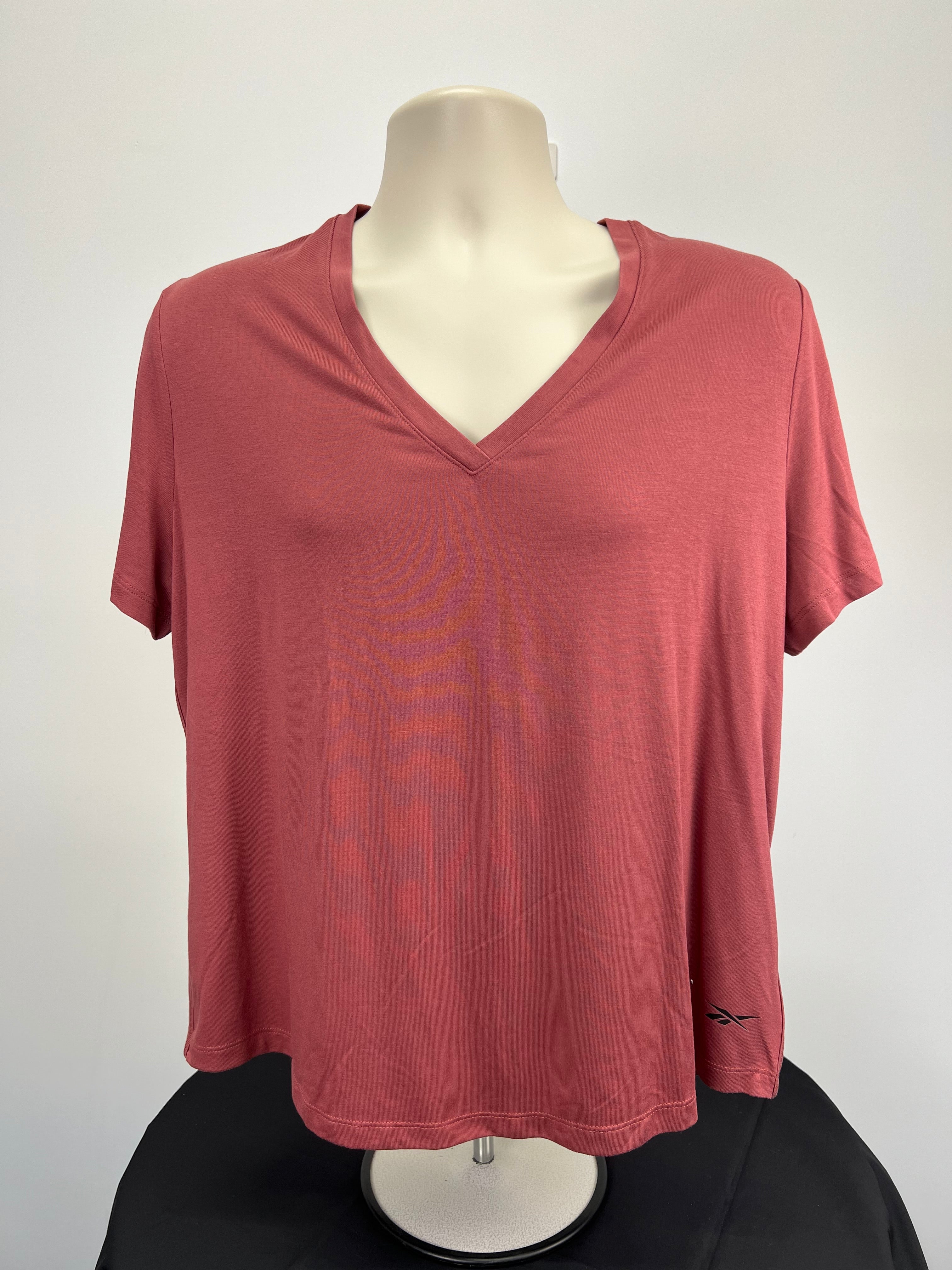 Front view of red clay Reebok Activchill V neck t-shirt on mannequin