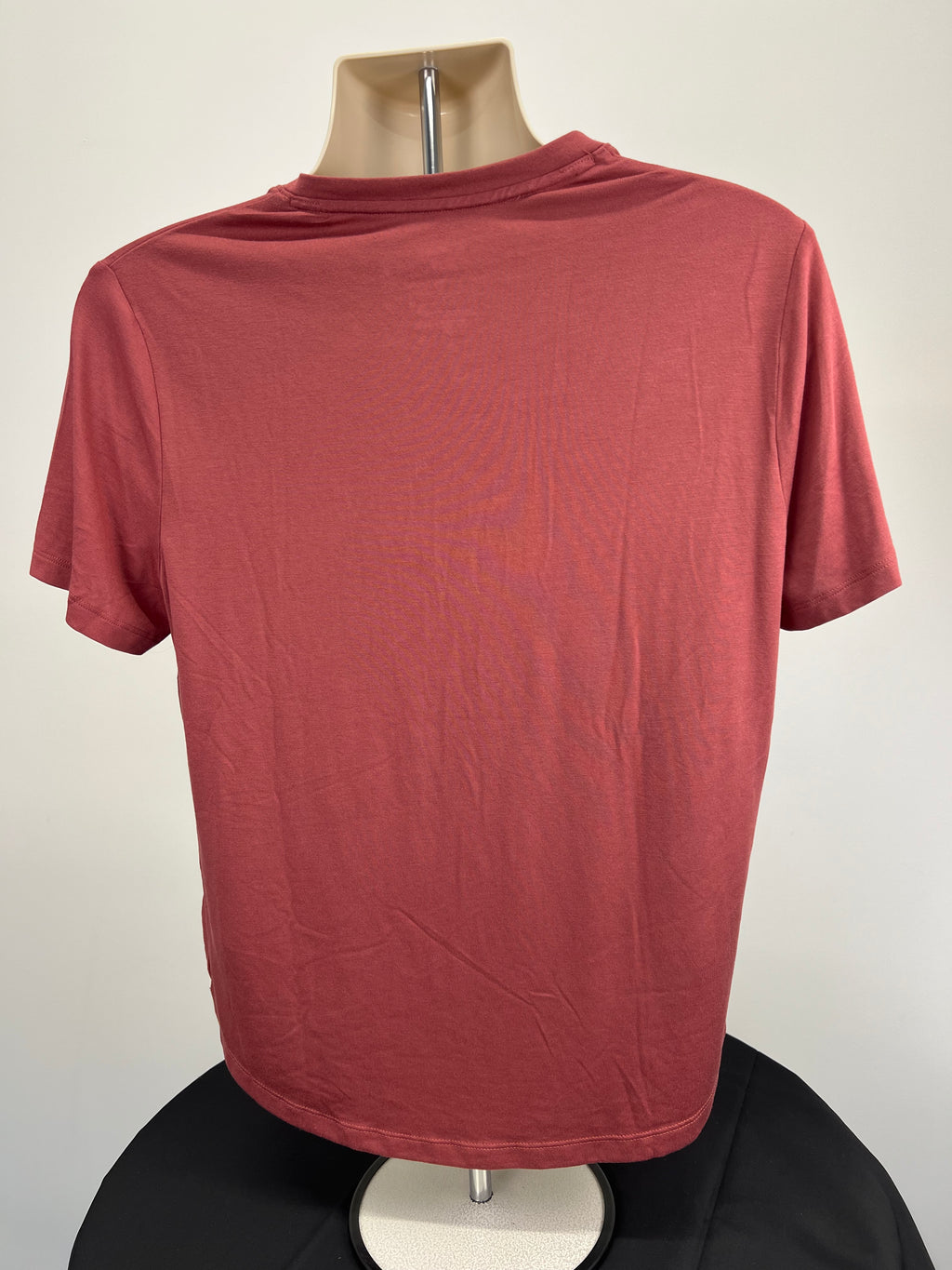 Back view of red clay Reebok Activchill V neck t-shirt showing simple design