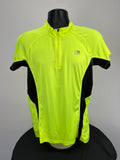 Front view of bright green Karrimor run 1/2 zip top with black side panels