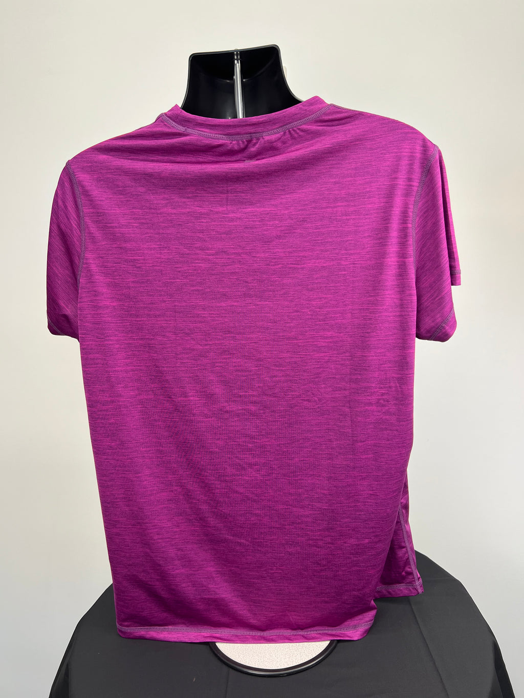 Rear view of Mountain Warehouse purple round neck T-shirt on mannequin