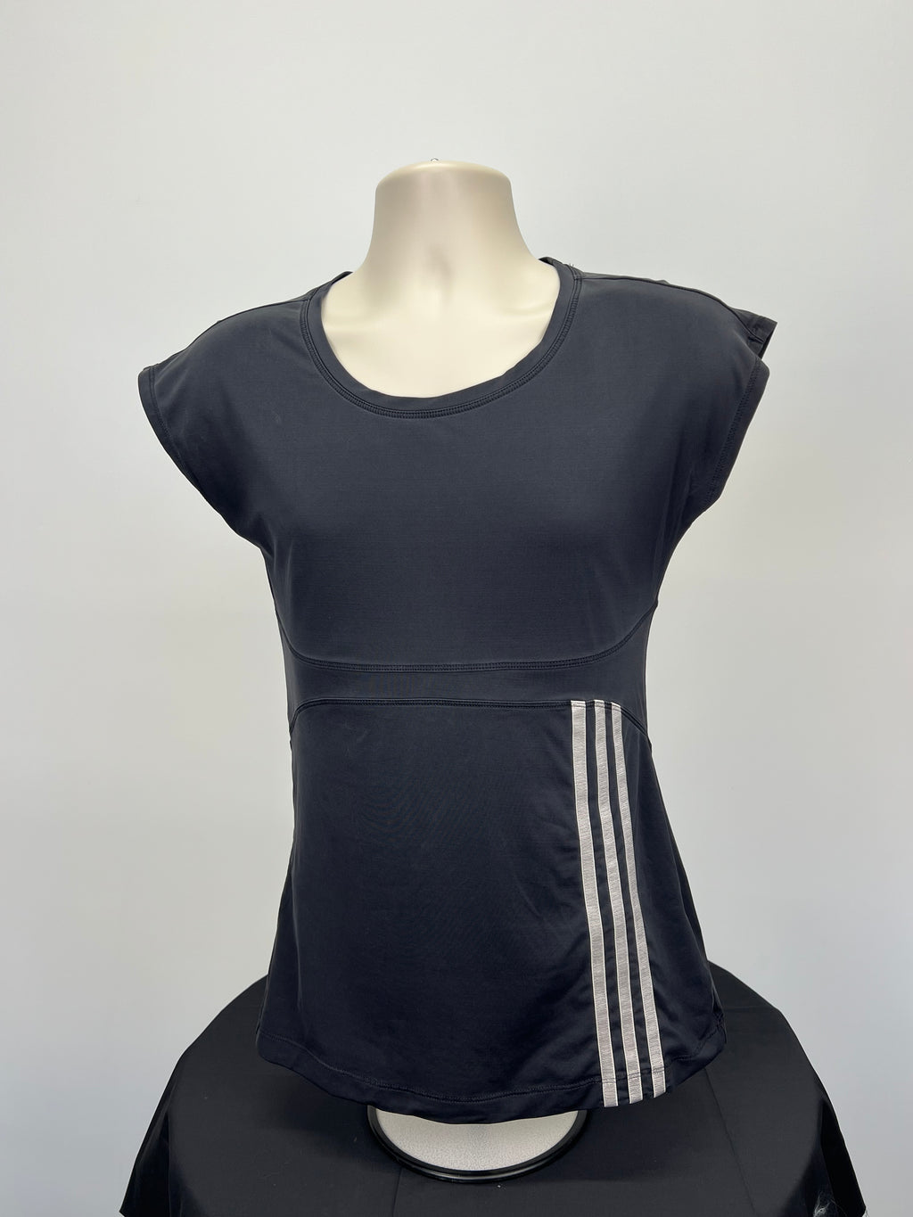 Front view of Adidas black tunic length t-shirt with white three stripes on side