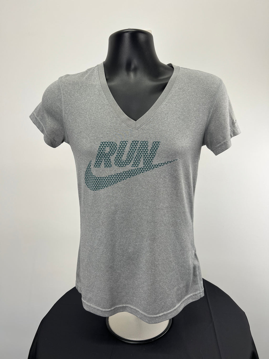 Front view of Nike grey V-neck running t-shirt with geometric RUN and swoosh print