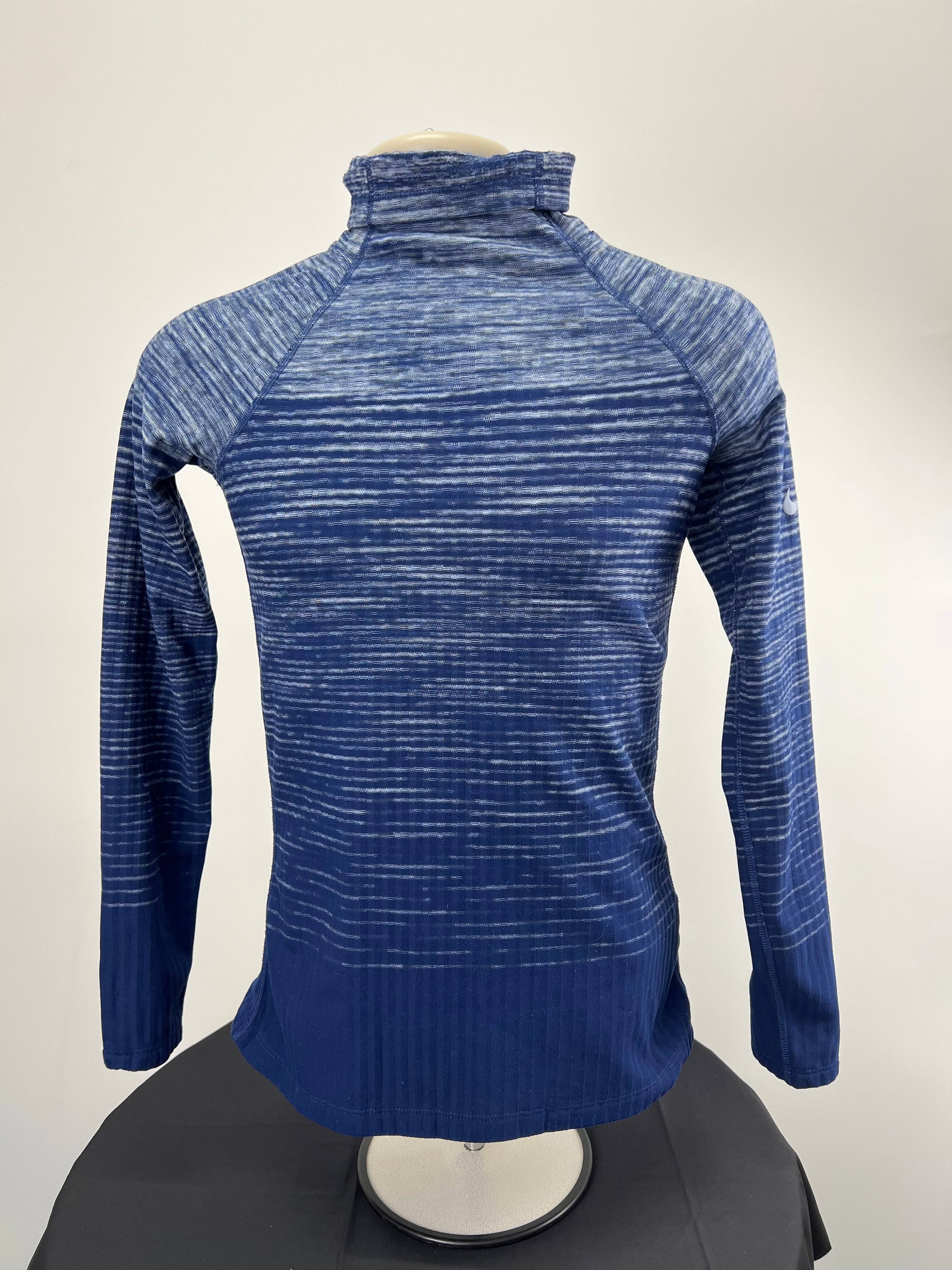 Nike Pro HyperWarm blue funnel neck top back view showing the pattern and neck design