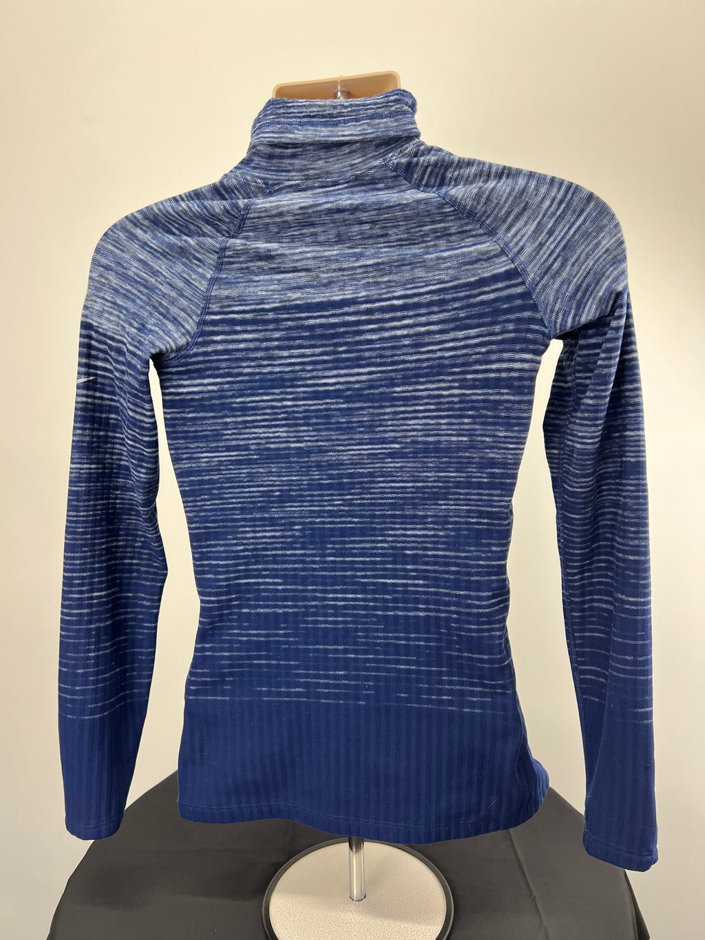 Nike Pro HyperWarm blue funnel neck top front view on mannequin highlighting the textured fabric
