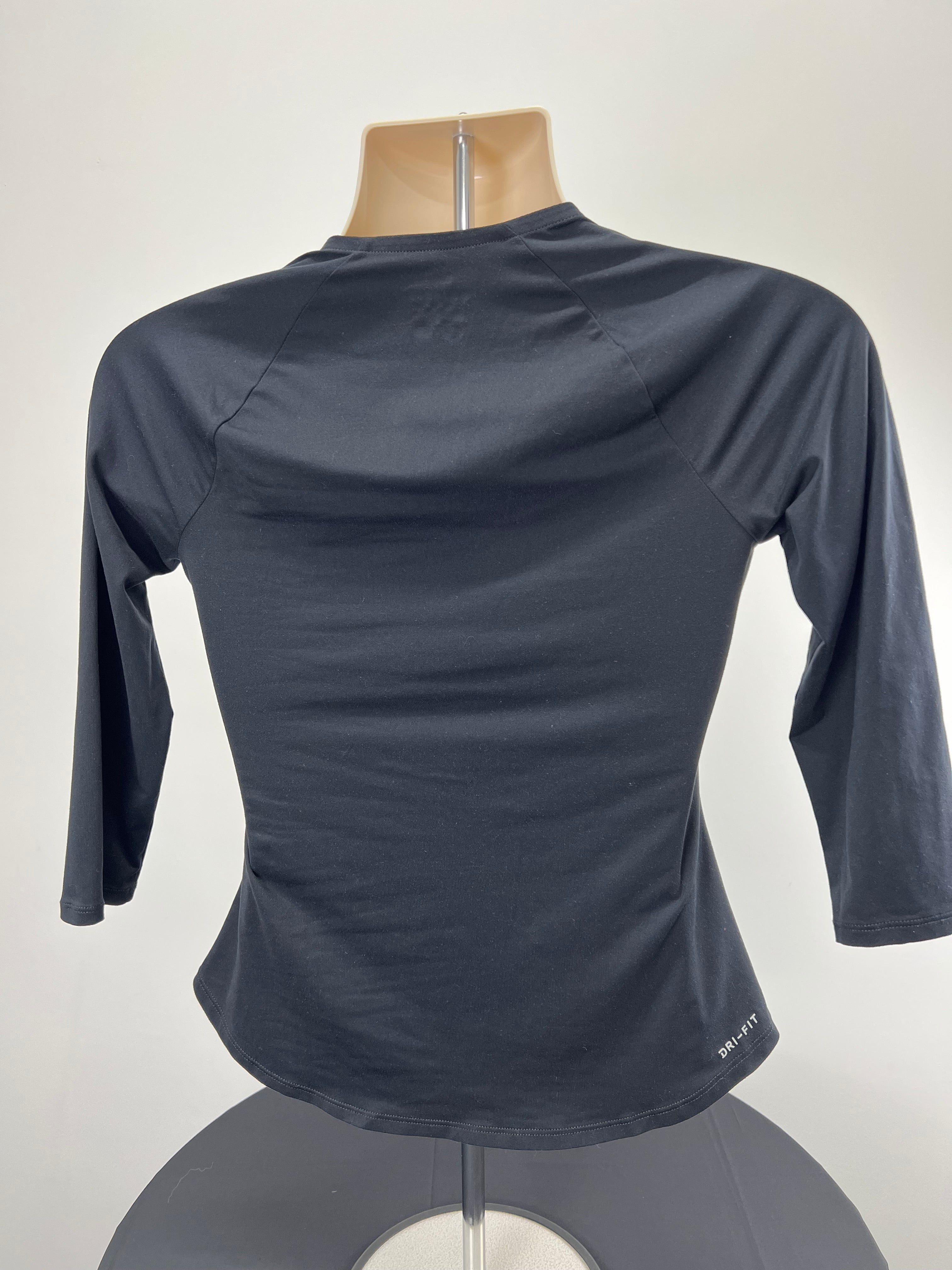 Back view of women’s Nike black long sleeve top showing Nike Dri-FIT logo