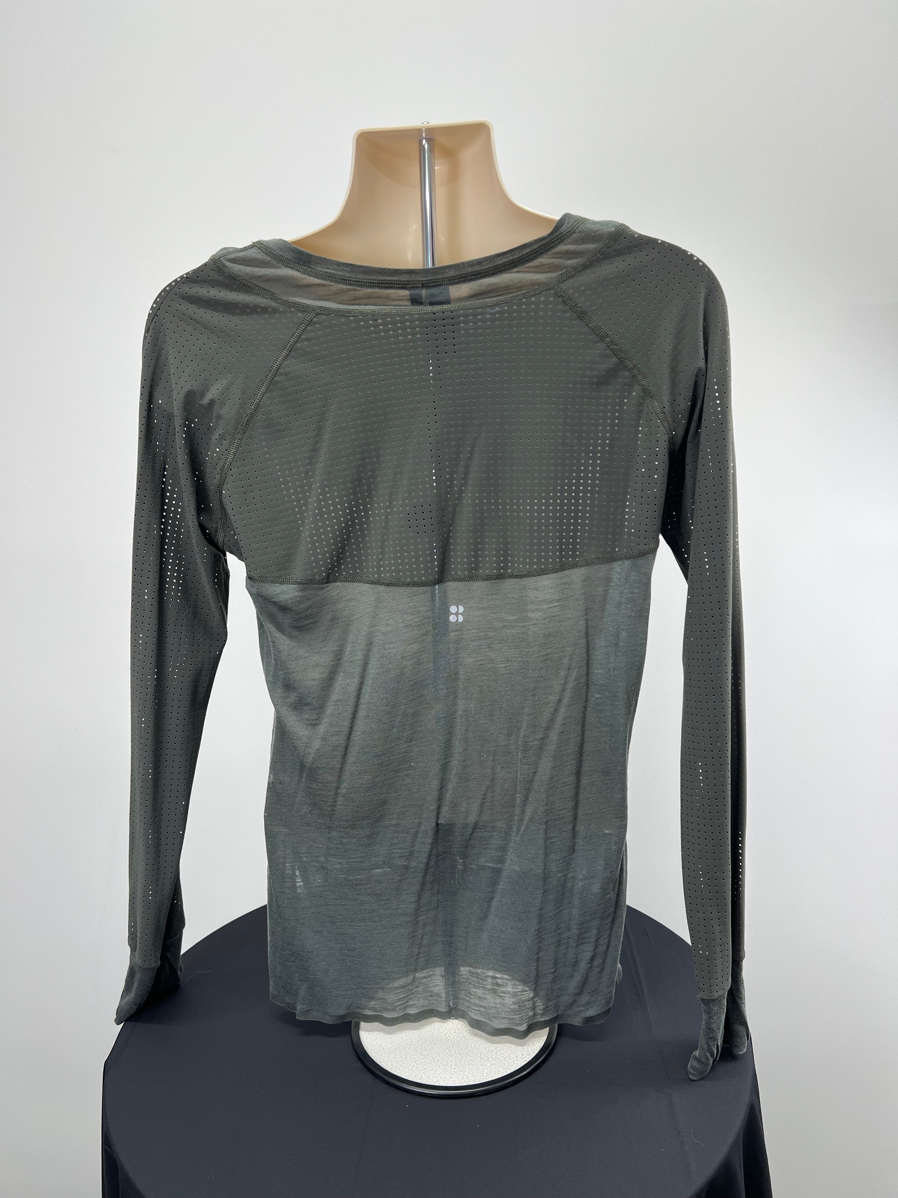 Back view of Sweaty Betty grey long sleeved top showing perforated panel and thumbhole cuffs