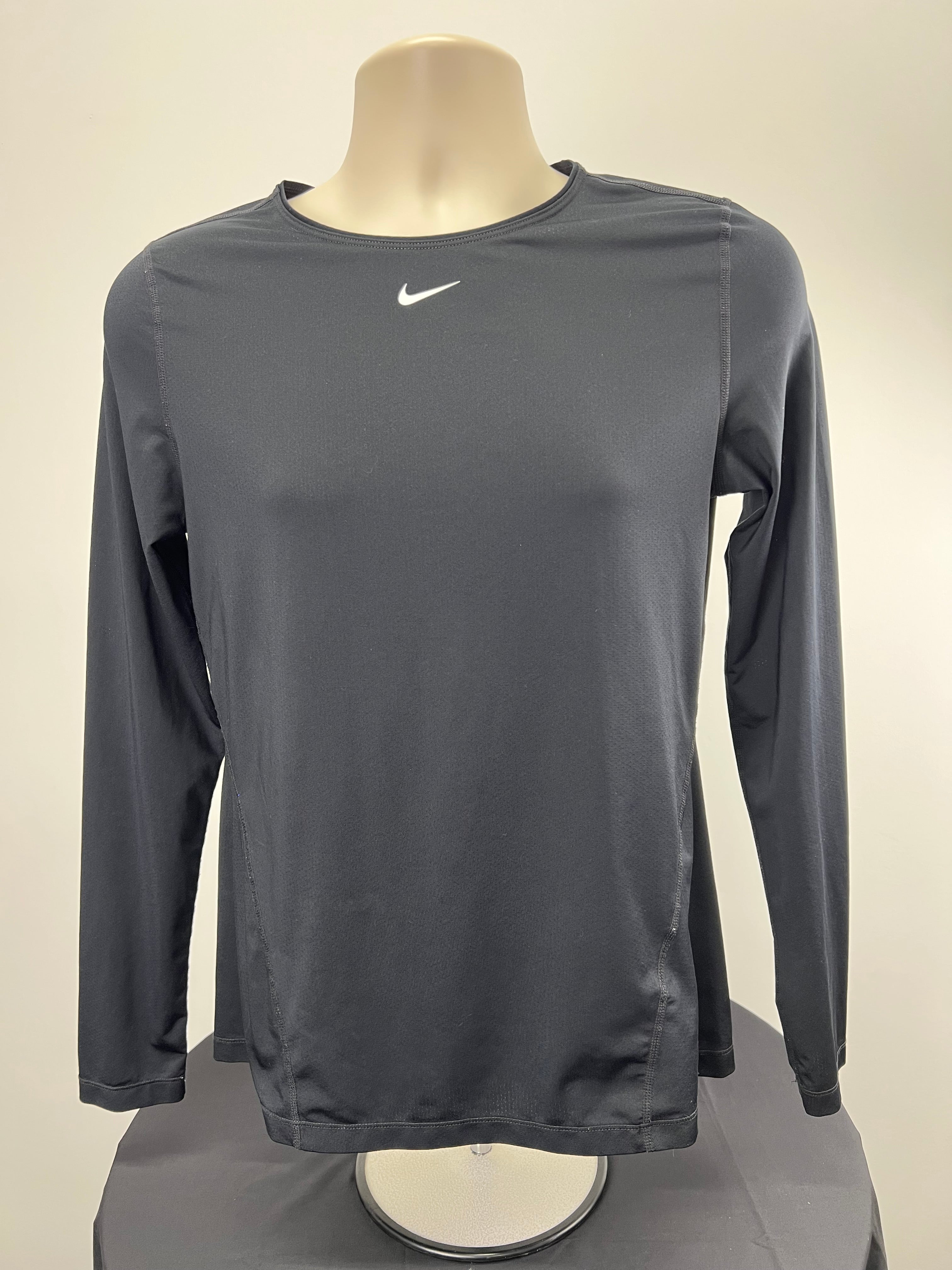 Front view of Nike women's black long sleeve top on mannequin