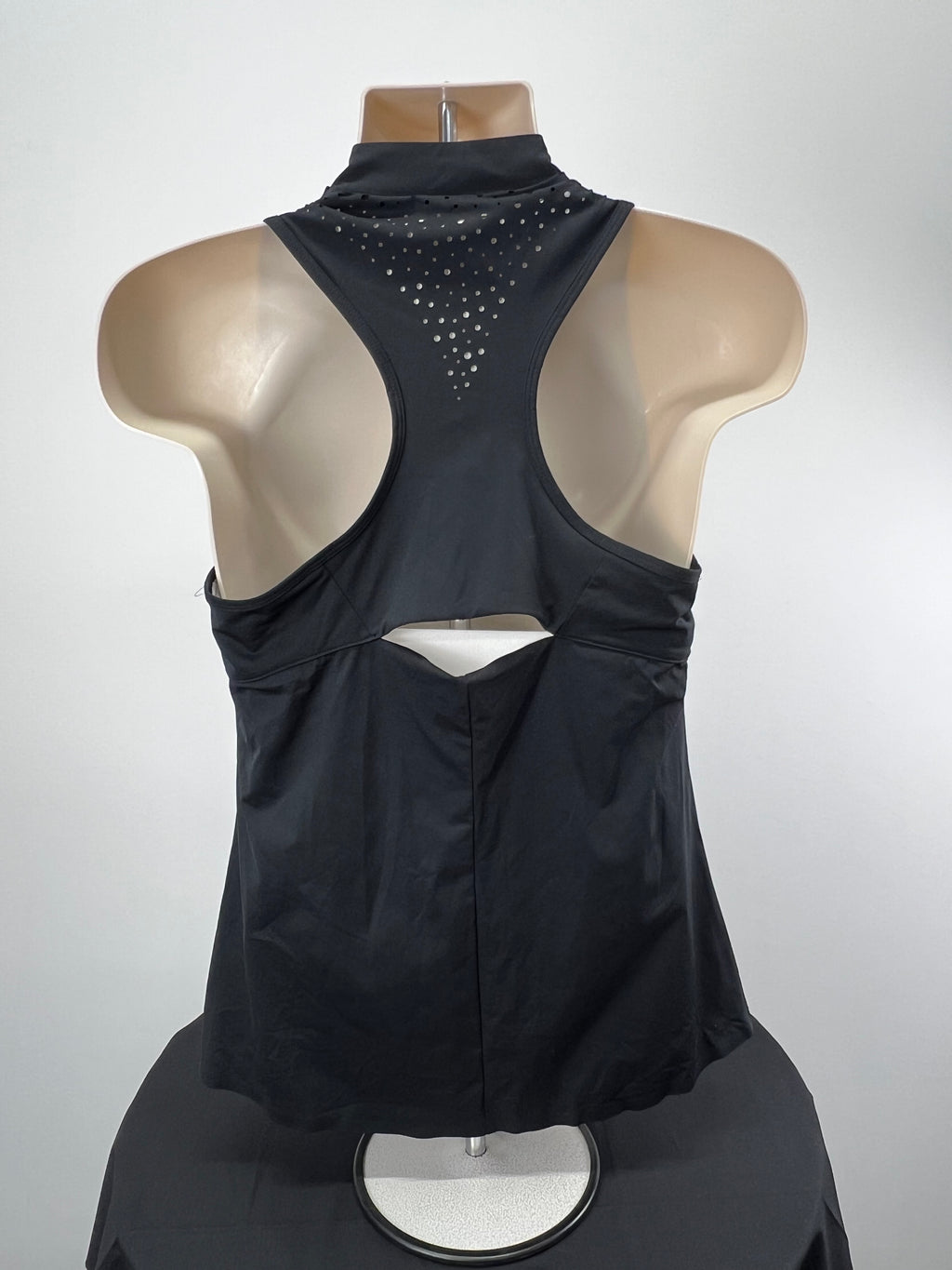 Back view of Adidas black sleeveless 1/2 zip top showing racerback and perforated detail